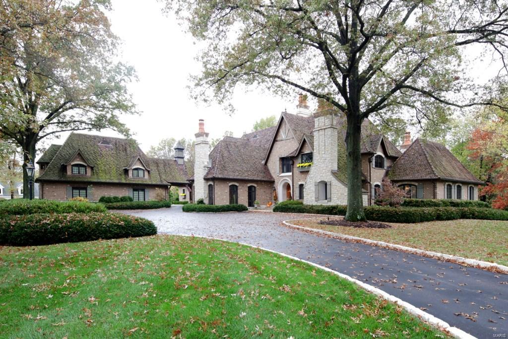 Splendid one of a kind custom home on 2 acres. Exceptional architecture & materials. Designed by Pape Studio & built by Minton Homes with over 11,000 SF of living space.  The home is designed around a 64' loggia accessible from the majority of the home's living space balanced by an incredible 30x17 living room with a 20' cathedral ceiling, raised paneled walls & 3 elevations of 8' windows. The kitchen area including a 5' commercial range, walk-in pantry, butlers pantry, wine room & family/hearth room. The breakfast room patio has a built-in grill & wood burning pizza oven. The master wing has a sitting room opening to the loggia, master bedroom with 13' ceilings & 2 elevations of full height windows, luxury bath, 2 dressing rooms & the formal parlor that can also serve as a study. There are 3-2nd floor bedroom suites, plus a garage apartment. Features include-6 FP's, custom surfaces & millwork in every room, 2 laundry rooms, finished LL, porte cochere, oversized 3-car garage & more.