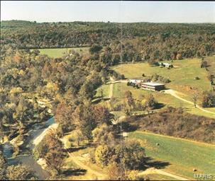 320 secluded acres on Turkey Creek fed by 5 independent Ozark Springs. The springs gushes 15,000,000 gallons a day. It's a trout stream that rushes through the ranch for 1 mile providing exciting TROUT fishing for the fisherman from the novice to the expert. The year round COLDWATER spring fed stream offers a variety of conditions from beautiful rapids to slow moving currents, sunny shallows to shaded deep pools, unique to both fly-fishing and light tackle fishing, Turkey Creek offers it all. The ranch previously was operated as a recreational Trout Fishing Park for years. It has a 22 bed lodge and an independent restaurant with commercial grade kitchen. Think that's enough, the property is well pastured for horses or cattle. There is a 2200 square foot, ranch style main house and a 1500 square foot guest house. The owner will throw in the tractors, backhoe, dump truck and other personalty pictured. This magnificent property is being offered turn-key. $OWNER WILL CONSIDER FINANCING$ Location: Rural