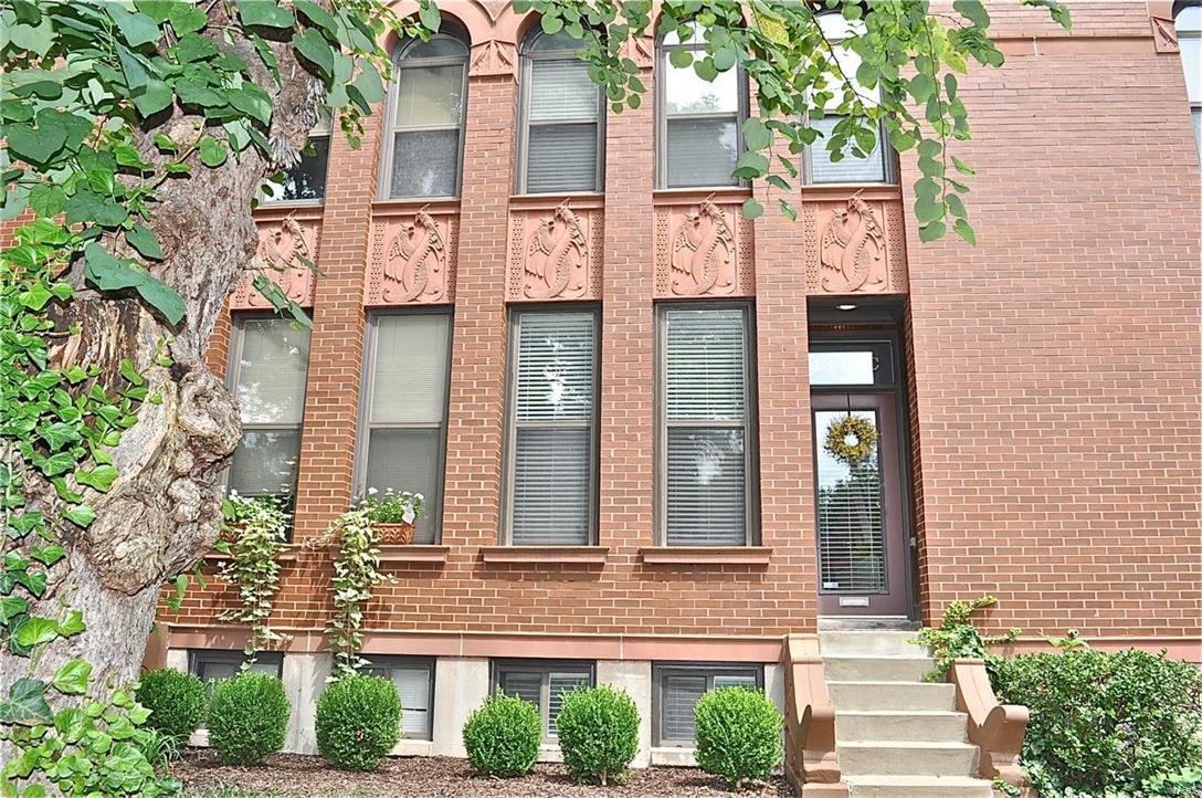 Spectacular CWE Manhattan Mews Townhome, with three finished levels. The first floor of this beauty boasts light-filled ten foot ceilings and wide open spaces. The living room features a wood-burning fireplace, built-in bookshelves, wood floors and access to the enclosed stone patio in the rear. The updated kitchen with breakfast bar, stainless appliances, and granite counter tops is a central gathering spot.  The finished lower level with wet bar and a full bath make for a nice family room and/or additional sleeping space for guests. The second floor includes a large master suite with wood floors and palladian windows, plus an additional bedroom with double closets. The condominium community includes ample common ground green spaces and a lovely pool, all a short walk to dining, fitness centers, and the renowned Washington University Medical campus. Location: City, Ground Level, Interior Unit