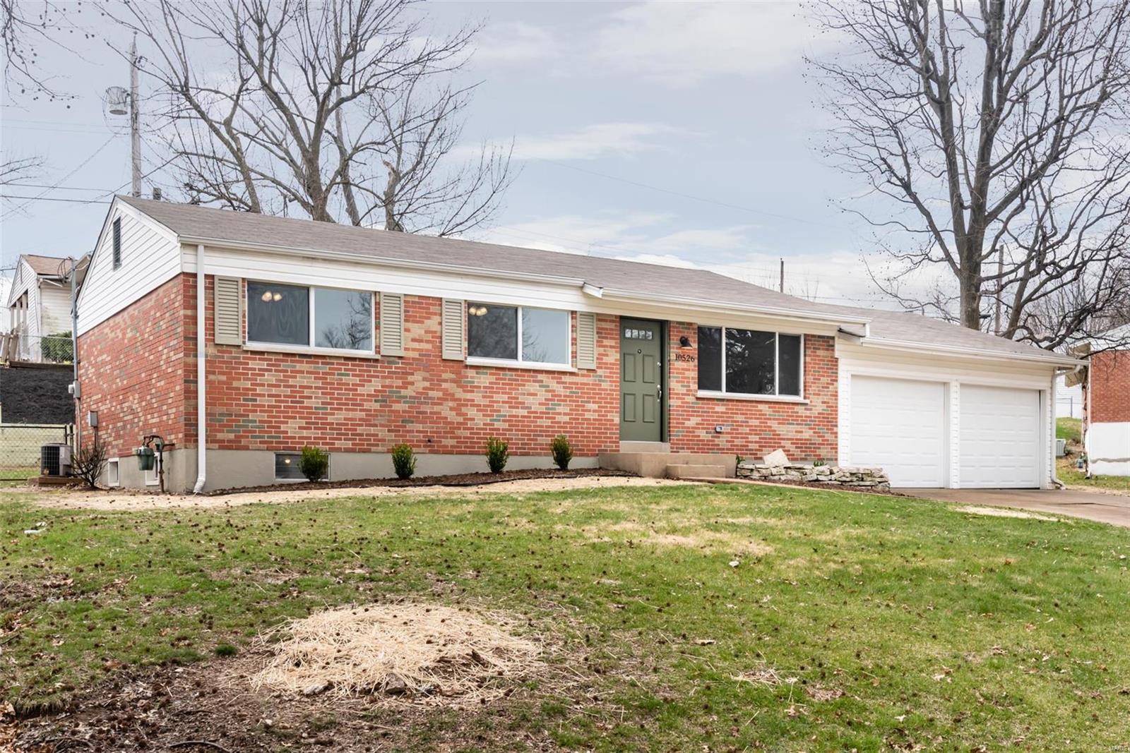 Perfectly renovated three bedroom two full bathroom all brick ranch at a great price!  This mid century cutie is 1014 sq.ft. and completely remodeled.  New windows let in tons of natural light, showing off restored hardwood floors and stylish fixtures.  Open kitchen features new cabinetry, counter tops, flooring and custom subway tile backsplash with new appliances.  Bedrooms are a generous size and bathrooms are clean and new!  Sitting on a large corner fenced in lot, nice backyard patio, and powered two car garage.  Central location on a quiet street!