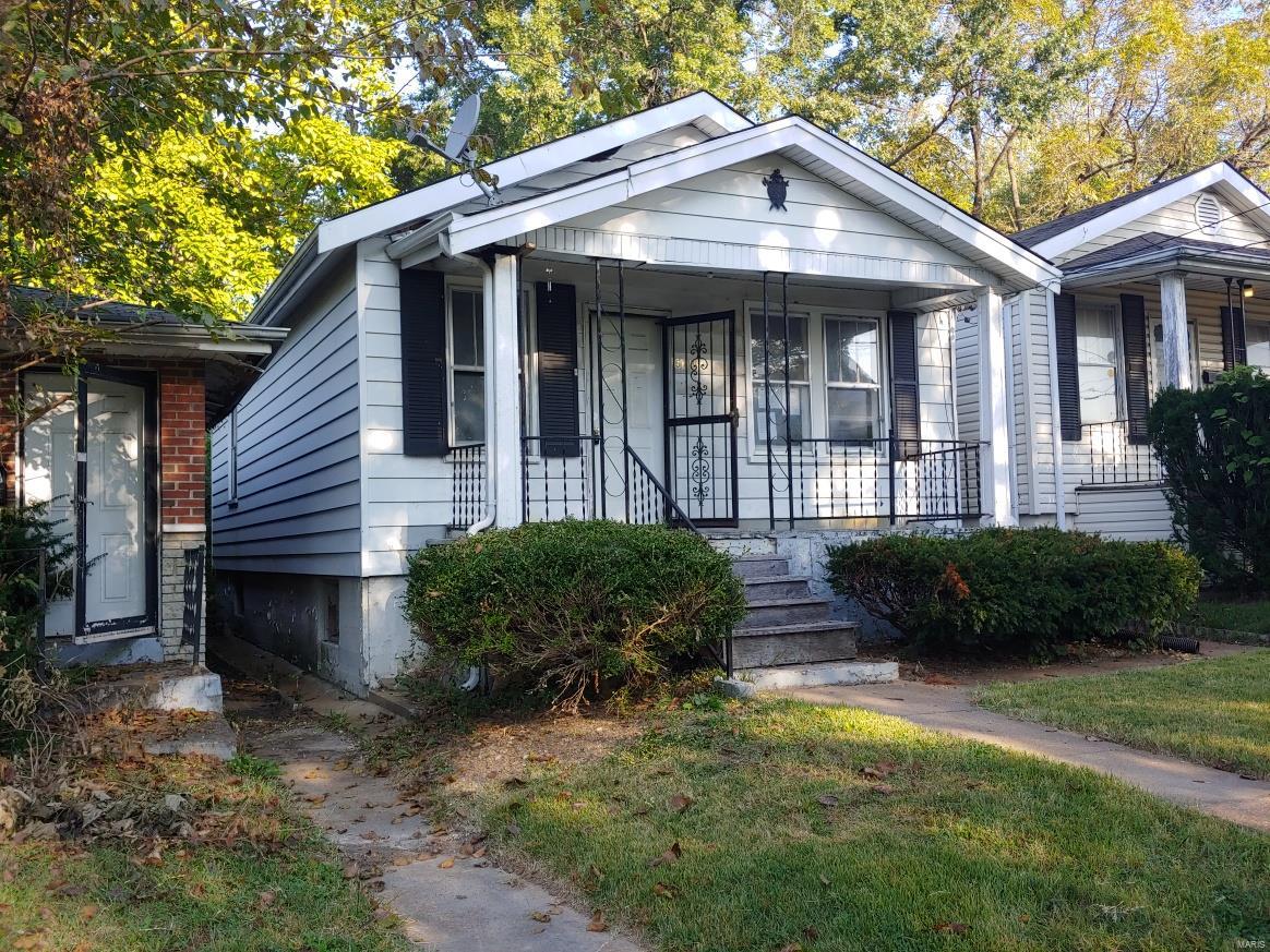 Bungalow Home Featuring: 2 Bedrooms, 1 Bathroom, Basement, Covered Porch. This home is being sold as is.