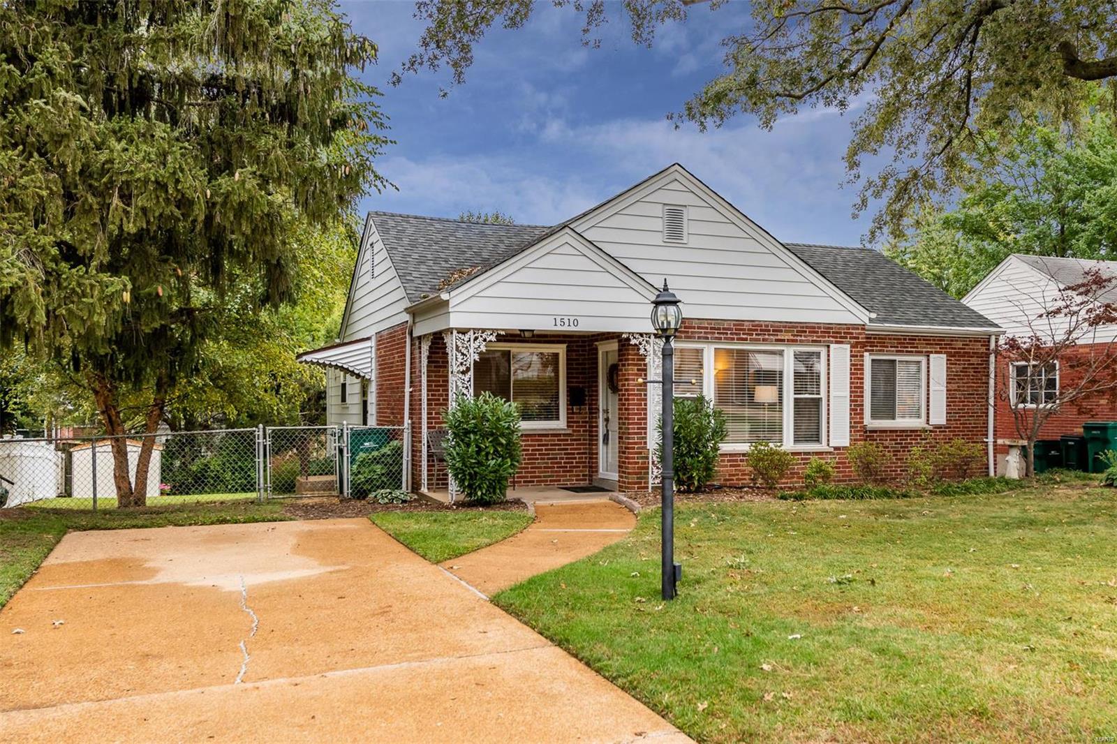 Beautiful brick three bedroom, 1.5 bath home in Webster Groves. Main floor features living room dining combo, eat in kitchen, three bedrooms and full bath. There are gleaming wood floors, thermal windows and neutral decor. The lower level is finished w/ family room and half bath. Need storage? You'll find it in the lower level utility shed. Major updates include newer kitchen, counter-top, stainless steel appliances and flooring. Other updates are thermal windows and tankless hot water heater. Make this beautiful home your home today.