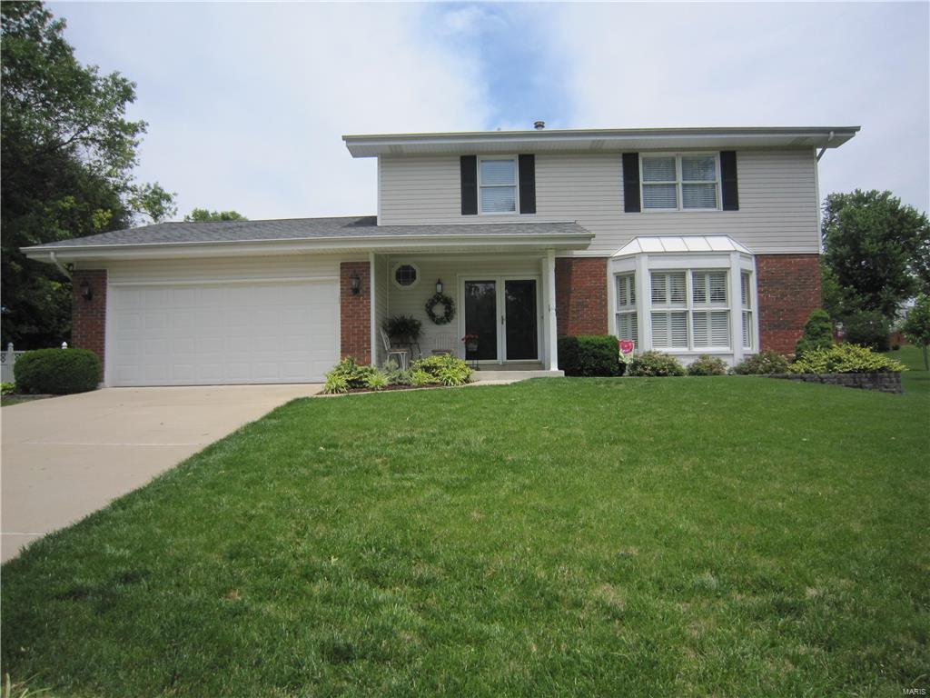 Meticulously maintained 2 Story, 4 bedrooms,  2 full and 1 half bath. Updated throughout, new kitchen cabinets gorgeous granite counter tops, and newer stainless appliances. All baths updated, cabinets and ceramic tile floors. Hardwood floors throughout the entire house first and second floors. Lovely screened back porch walks out to a patio and beautiful fenced back yard.  New roof   (9 months), newer siding, newer HVAC, hot water heater. The lower level has lots of extra space for the family to enjoy. Family room and playroom along with a spacious laundry room and storage areas. Lots of room in the large backyard for the kids to run around and enjoy.