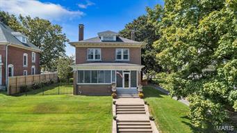 Own your own beautifully restored American Foursquare home located in Downtown Cape Girardeau. Built in 1925 this home boasts quality original craftsmanship that you will only find in homes of that era! The main level features a formal dining room, formal living room with fireplace and original built-in shelving, formal entry area, and large kitchen. The second story has 4 bedrooms and 2 full bathrooms. The basement has more living space with a family room and 15x15 laundry room with large sink for pet grooming. Relax while watching river boats on your front porch, along with a spectacular view of the Bill Emerson Bridge. The back yard has abundant space for entertaining along with a fenced area for pets or kids, hot tub, detached 2 car garage, and additional parking pad for 3 more vehicles. Complete list of extensive updates will be provided. Owner providing 1 year Choice Plus Home Warranty for buyer. Home is owned by the listing agent, Amanda Huber.