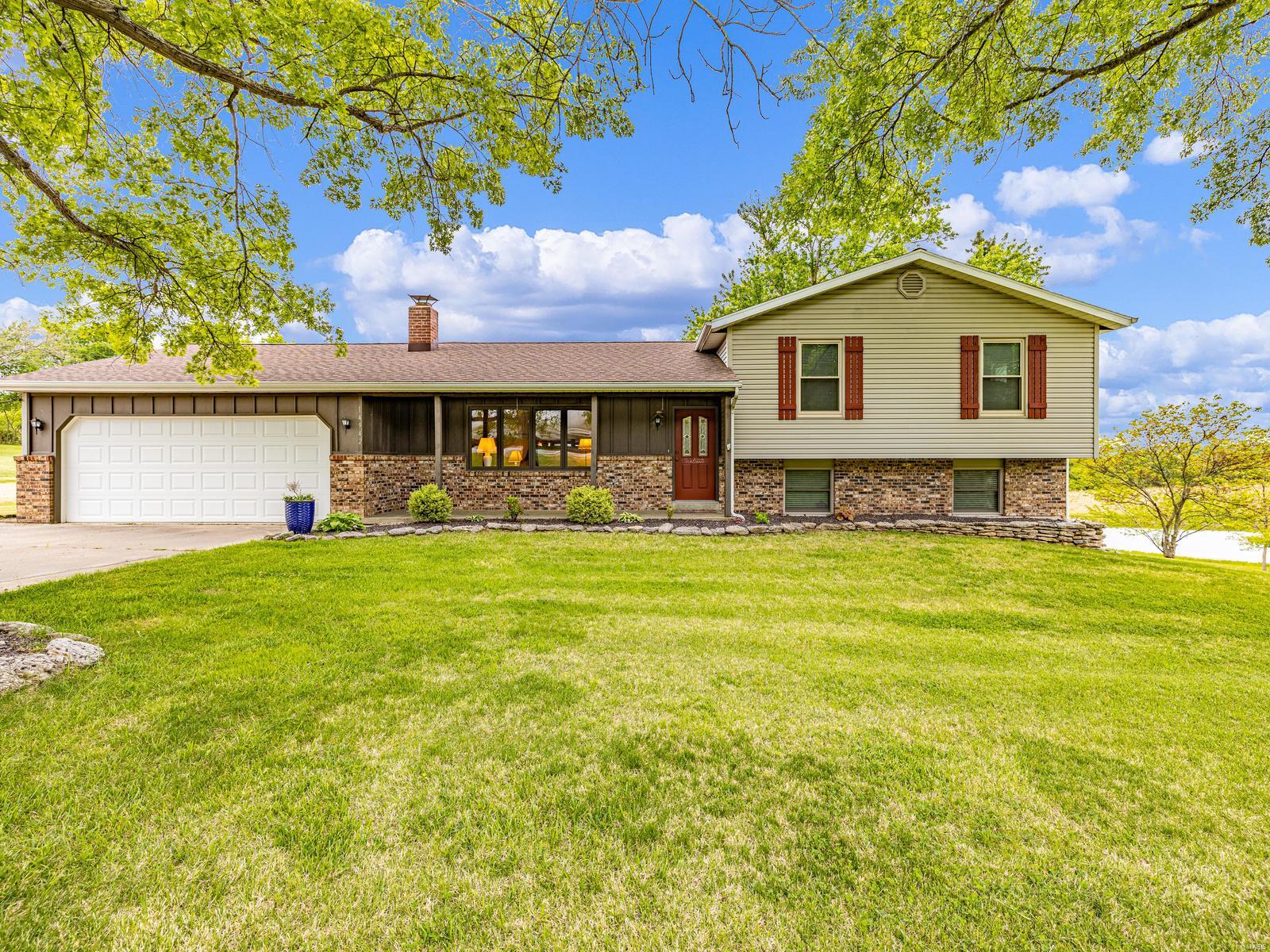 Are you ready for that every day vacation feel? If you are, then look no further. This meticulously kept home sits on top of over 3 acres of gorgeous land that is complete with your own stocked private pond, covered patio, above ground pool and huge out building that offers more room for more vehicles or just that extra needed storage space. Turn the key where you are greeted with a view that is hard to pass up. Gorgeous hardwood flooring shines throughout, and the kitchen is a chefs dream complete with double oven, black stainless steel appliances, center island, and cabinets galore. The family room features wood cathedral ceilings and a picture window that overlooks the pond, The upper level features three spacious bedrooms and the master has its own private full bath.  Head to the basement where you are greeted with a freestanding wood burning stove and finished area complete with a built in bar area. Main floor laundry is just an added bonus to this beautiful home. USDA eligible Additional Rooms: Mud Room