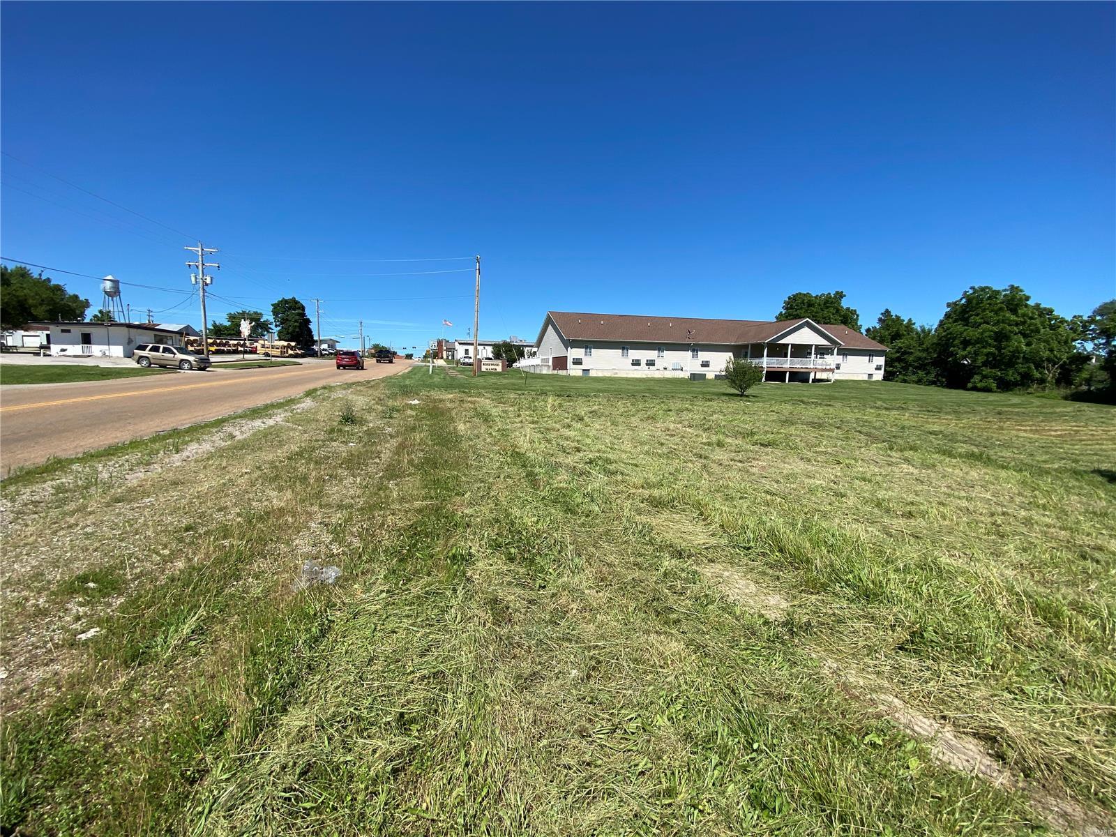Tons of potential with this great vacant lot property located within city limits. Totaling approximately 1.11 acres m/l these lots sit right off the main road through town and are adjacent to commercial and residential properties. Walking distance to everything in town. Don't miss out, this property won't last long. Zoned R-3