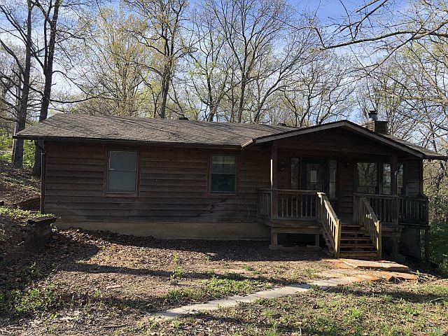 CEDAR HOME FEATURING 3 BEDROOMS AND 2 FULL BATHROOMS ON APPROC. 1.22 ACRES.  YOU WILL FIND A VAULTED CEILING IN THE GREAT ROOM WITH A FULL STONE WOODBURNING FIREPLACE AND OPEN FLOOR PLAN.  THERE IS A MAIN FLOOR LAUNDRY AREA, FRONT COVERED PORCH AND A CIRCLE DRIVEWAY FOR PARKING.  GREAT PLACE TO CALL YOR OWN.  CHECK IT OUT TODAY. Please refer to HUDHomestore for the most recent bidding Period details and information on this property.  HUD Acquired Property. Property being sold 'AS IS'. All utilities are turned OFF. Please, use discretion when showing and bring a flashlight.