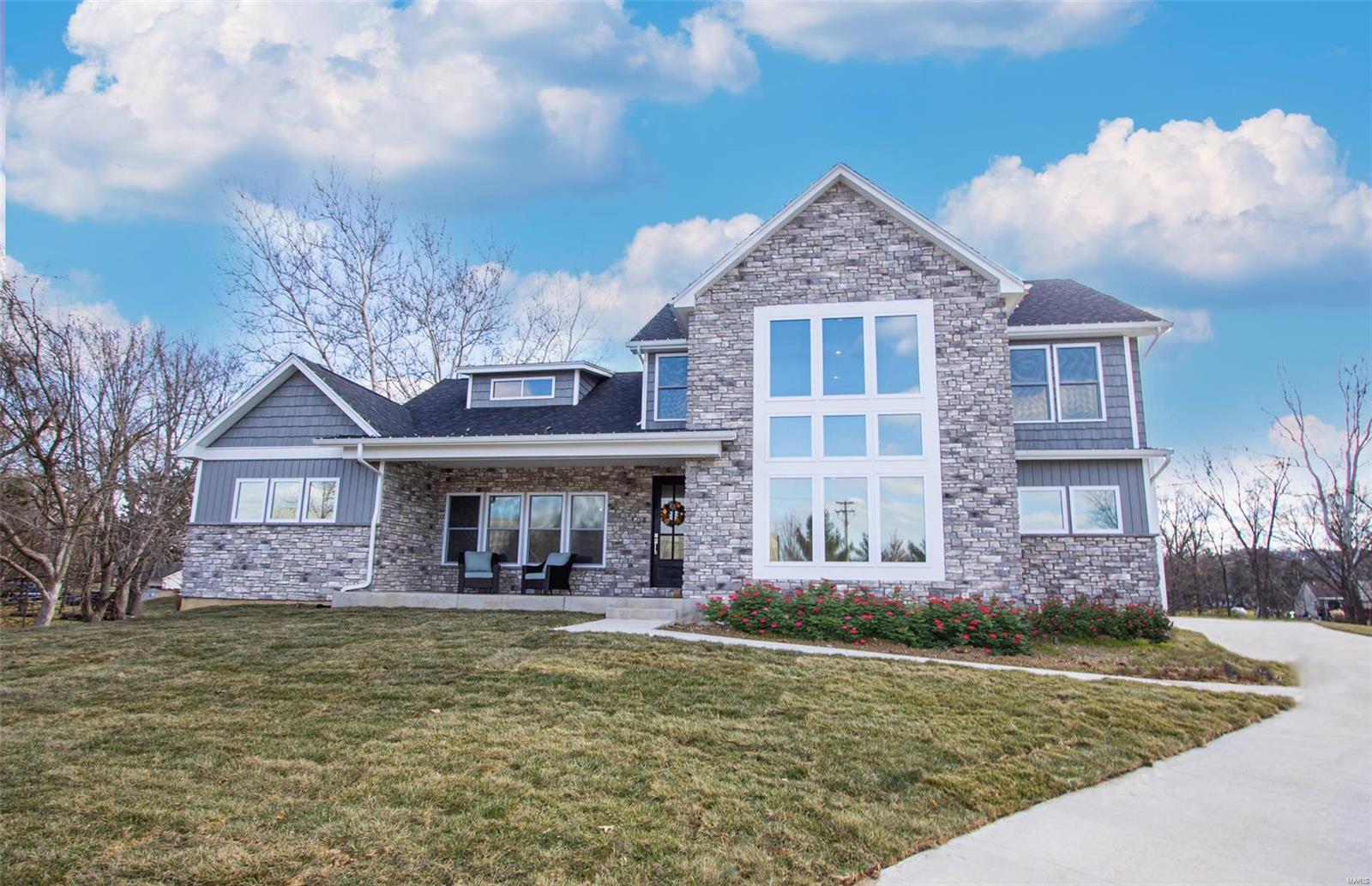 Move in ready in early September. Exquisite custom home on unheard of 1 acre level lot in Fenton! Thoughtfully designed & meticulously built, this 5000 sq ft home is what you have been looking for. With the attention to quality construction & detail, efficiency meets design with a Great Room w/ floor to ceiling stone fireplace, Gourmet Kitchen, & feature Window Wall. Kitchen with quartz countertops, Thomasville cabinets, SS appliance package, & hidden walk-in pantry. Split floor plan offers privacy for Main Floor Primary Suite w/ its free standing tub, double sinks, & walk-in closet. Main Floor Laundry & MudRoom w/ access to 24 ft deep 3-car side entry garage w/ 8ft high extra wide doors. Roughed In Lower Level ready for you to finish when & if you like. Smart Home Technology throughout. Photos of Display Home & Digital Renderings depict optional upgraded finishes. Call today to personalize your dream home! Additional Rooms: Mud Room