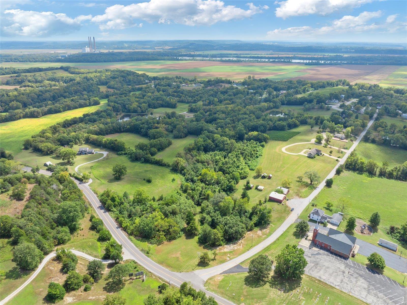 Fantastic Opportunity in the Heart of Missouri Wine Country!  Don't miss this nearly 22-acres tract with 639+/- ft  road frontage along S Hwy 94 and 895+/- ft along Church Road in Augusta. High visibility and mostly open and gently rolling terrain, it offers picturesque views of the surrounding area. With the visibility and road frontage this could be the next location of your commercial venture or prime location for a large lot development. Located in the Missouri Rhineland, the surrounding area has much to offer....wineries, restaurants, B&B's, antique shops, trolley tours, the Katy Trail and so much more. Take a look a look at the proposed RV Park layout or bring your own ideas and put this property to work for you!