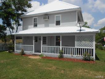 Unique early american remodeled  home on .60 acres m/l.  Has 3 bedrooms, 2.5 bathroom, electric baseboard heat, and window air.    The home has a beautiful setting with a 24 x 32 workshop with wood floors, electric, and an added 12 x 12 freezer building with storm cellar.  There is also a lean-to with metal roof  and fencing for dog pen. The home has a wraparound front porch for relaxing on  and a nice deck on the side of home. The home had vinyl siding and a new metal roof. This home has been  remodeled and very tastefully done.