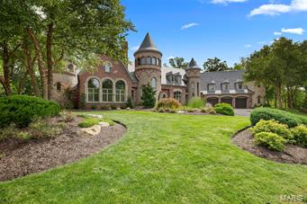 You've made it to the top, now you can live there! Private 6+ acre oasis for first-class modern living w/ old world charm, panoramic & river views! European-style home is a showcase of high-end & detailed craftsmanship: Architectural distinctiveness thru-out 8882 sf. Main flr Master Suite w/FRPL, tall arched ceiling+Spa-like bath, whirlpool tub + 2-sty 'waterfall' stone shower built-in turret tower! Two-sty Great Rm w/arched doorways, wood flrs, custom built-ins, flows in into open dining, Breakfast & Hearth areas + Breakfast bar & gourmet Kitchen w/Viking appliances, custom-crafted cabinetry on Limestone floor w/ access to front service entrance & huge rear deck w/FRPL overlooking in-ground Pool/Spa & breathtaking views! Fin. Low Lev with Wet Bar & Walk-in Wine Cellar, Powder Rm, Family Rm w/FRPL, Gym & Bedrm w/Bath: Pool area w/fire pit, covered patio w/FRPL & flat screen TV: Customized landscaping w/Koi pond: Gated entrance & located w/in private CC within championship golf courses.