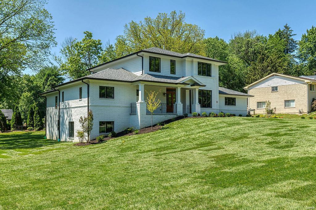 Great opportunity to own a new home in Ladue Schools finely detailed throughout. This 1.5 story model features a main floor master suite that features an attached sitting room/office/nursery.  The luxury master bath features an air jet soaking tub, large shower, designer tile work & specialty cabinetry.  The open floor plan is perfect for entertaining and enjoy a large maintenance free deck for summer barbecues!  All room sizes are very generous and all bedrooms feature walk-in closets with solid shelving.  The WALKOUT lower level features a 5th bedroom and large rec room with a wet bar and tons of light.  Other features include 10 ft ceilings on 1st floor/designer fixtures throughout / sprinkler system / professional landscaping / 3 car garage /High-end appliances / cozy hearth room w/ 2nd fireplace/mud room / central vac system and much more!   This home is now 100% completed and ready for viewing Additional Rooms: Mud Room COOL: 14 SEER+