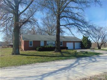 Country Paradise- Close to town and only 3/4 mile of gravel.  Lots of road frontage for dividing for family members, etc.  On this 18.36 Acres, Home features 3 bedroom, 2 bath, open floor concept with 1200 square feet. Freshly painted covered deck for relaxing on a summer evening.1st Barn 45 x 60 with 11 foot lean to.  2nd Barn 20 x 20.  Stocked pond/lake with bluegill, bass and catfish.  Property fully fenced and different fenced pastures. New Carpet in bedrooms, new tile in bath, laundry room and hallway.  Carpet in living room only 5 years old.  Energy Efficient windows installed 4 years ago, 3 new exterior doors and 5 interior doors.  2 new garage doors.    Both baths updated.  Dishwasher only used 6 weeks. Fresh paint in bedrooms, laundry, hall and living room.  Blown in insulation in attic 3 years ago.  Floor in kitchen 2 years old.  2 new hydrants (backyard and 1st barn.     New gages on owned propane tank.