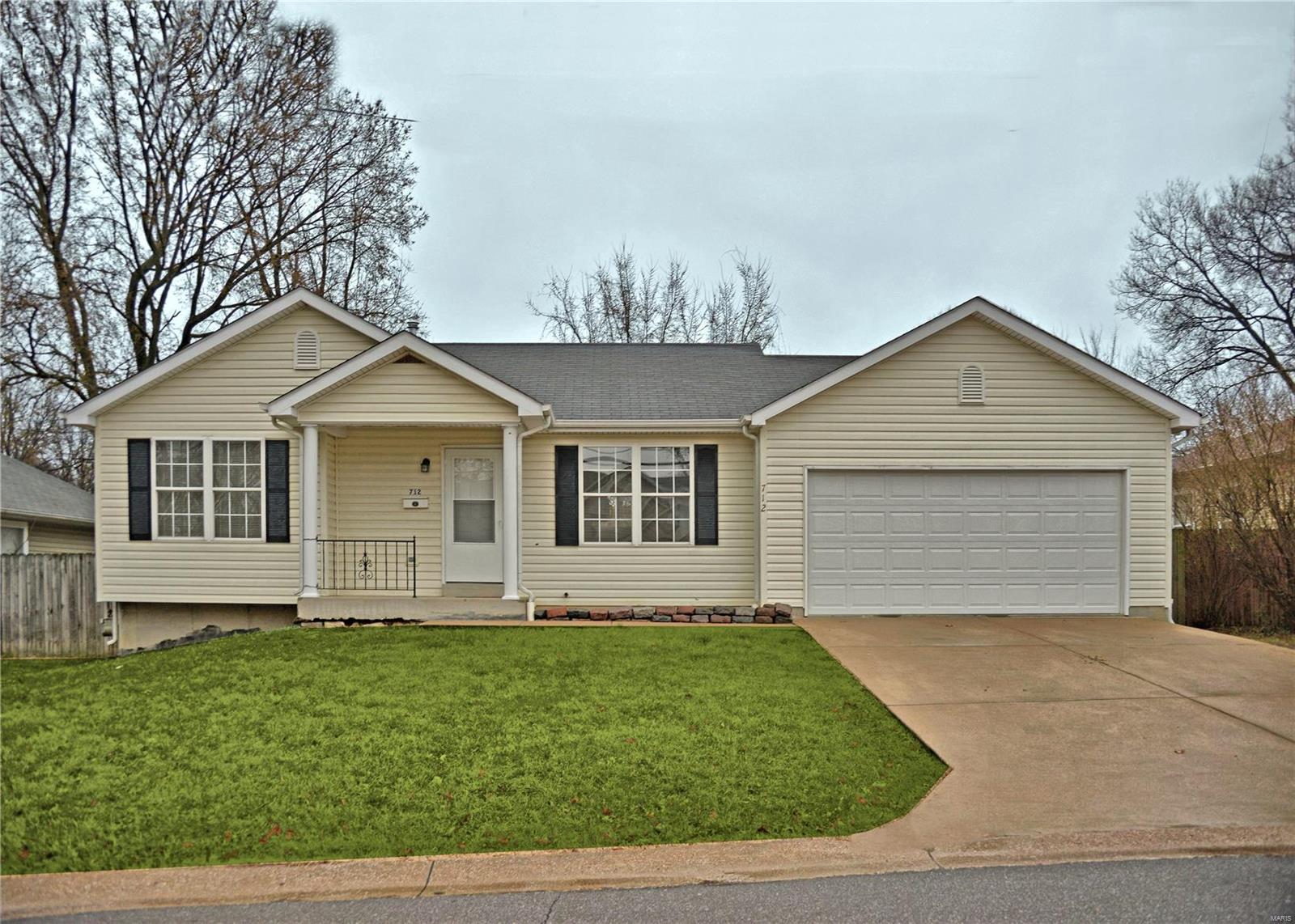 MULTIPLE OFFER SITUATION. Exceptional value in this 3 BR ranch in the award winning Webster Groves School District. The home is highlighted with covered front porch, decorative shutters & maintenance free exterior. The open floor plan boasts a spacious living room featuring gas fireplace with built-in shelving and a ceiling fan. The adjacent eat-in kitchen has white cabinetry, breakfast bar and access to attached 2 car garage. The main floor has 3 BRs serviced by a full bath and linen closet. The lower level provides ample storage, a bathroom rough-in and a finished flex room that could be a sleeping room, gym, office or family room. The fenced backyard is perfect for entertaining with a patio and lots of grass space. All new flooring on the main level! Don't miss this wonderful home! 13 Mo HWA Home Warranty included!