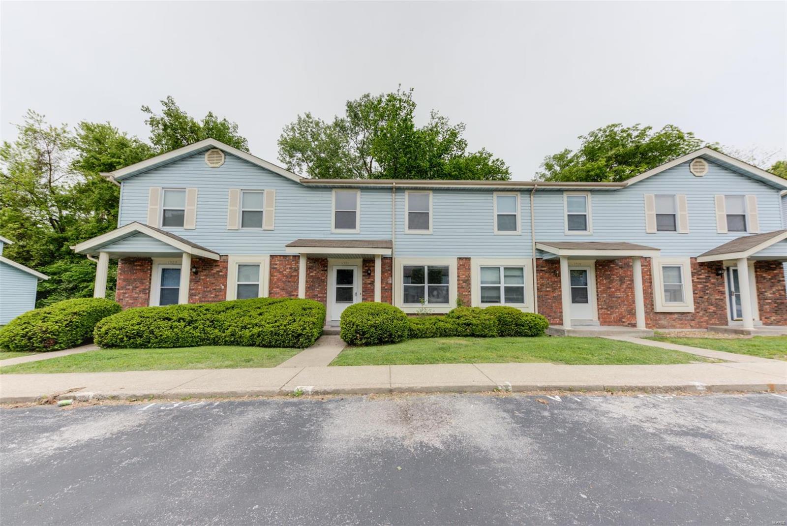 Welcome to this 2 story Town home with great access to highways 364 & 70.  Main level offers a Large living room, ½ bath, ample size kitchen, breakfast bar, and separate breakfast room, and main floor laundry.  Upstairs you will find and 2 large bedrooms with ceiling fans, and full bath.   HVAC (2014). Newer carpeting throughout and new vinyl in kitchen and pantry / laundry (2017).  Refrigerator, Washer and Dryer are included in the sale. Full basement with plenty of storage. Parking in front of the unit. Pool available to residence with additional fee. Location: Interior Unit