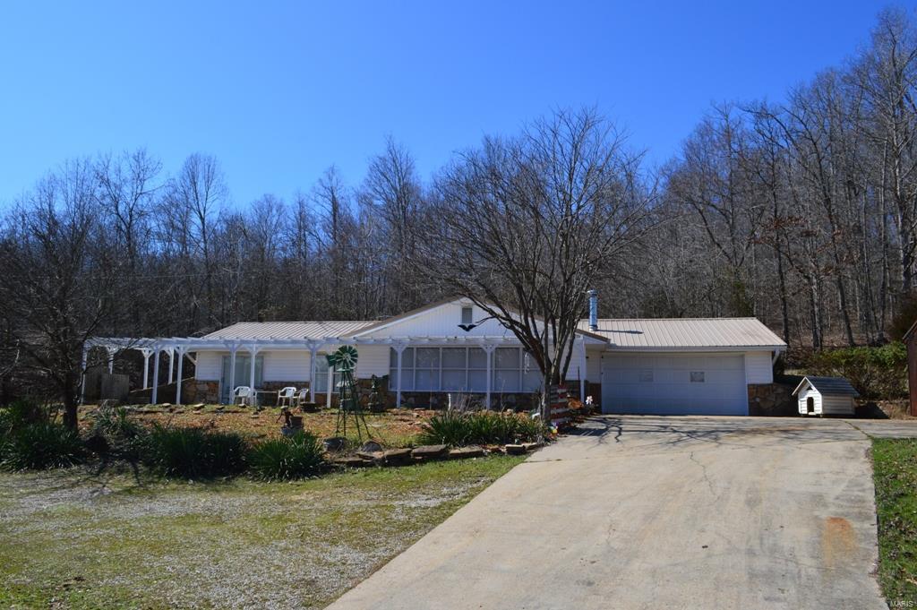 Over 1400 square foot house just outside of town. This 2 possibly 3 bed 1 and a half bath home feature a huge living room, a gas fire place.