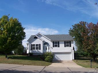 This 3 bedroom, 2 bath split level home with easy access to all of the Hwy K shopping and Hwy 70 has lots of charm. Features include vaulted ceilings in the kitchen & great room with lots of windows for natural light, brand new carpeting throughout, ceramic tile flooring in the kitchen with stainless appliances, the spacious lower level features a family room, laundry room and large 14 x 11 unfinished area for storage. A recently stained deck overlooks a beautiful fenced back yard with lots of trees. Other great features such as an over sized 2 car garage with automatic opener, low maintenance vinyl siding, enclosed soffiting, updated windows, lighting & ceiling fans. 1 year HSA Warranty included. 1116 main level SF, 431 finished lower level SF per St. Charles County tax records for a total of approximately 1547 Square Feet.