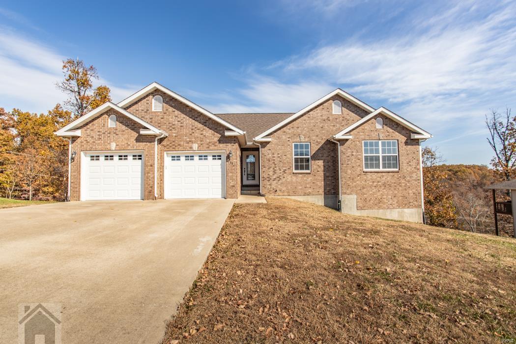 This is a beautiful 5 bedroom, 3 bath home located in the highly desirable Woodridge Subdivision at an amazing price. This home is full of updates you'll notice as soon as you walk in. Enjoy the wood flooring through the upstairs area, fireplace in the living room and a functional kitchen featuring stainless steel appliances, pantry, breakfast bar and tile floors for easy clean up. Off of the kitchen you will find two sizable bedrooms and a guest bathroom. Also upstairs is the main floor laundry area and a large master bedroom that has a vaulted ceilings, and walk in closets with a master bathroom suite featuring a jetted tub, separate shower, and his and her sinks. Theres more space to love downstairs in the massive family room area which is carpeted for comfort and features a second fireplace. Just down the hall are two more bedrooms and a full bath. This home has a huge unfinished storage area where you can store anything your heart desires! Schedule your showing today!