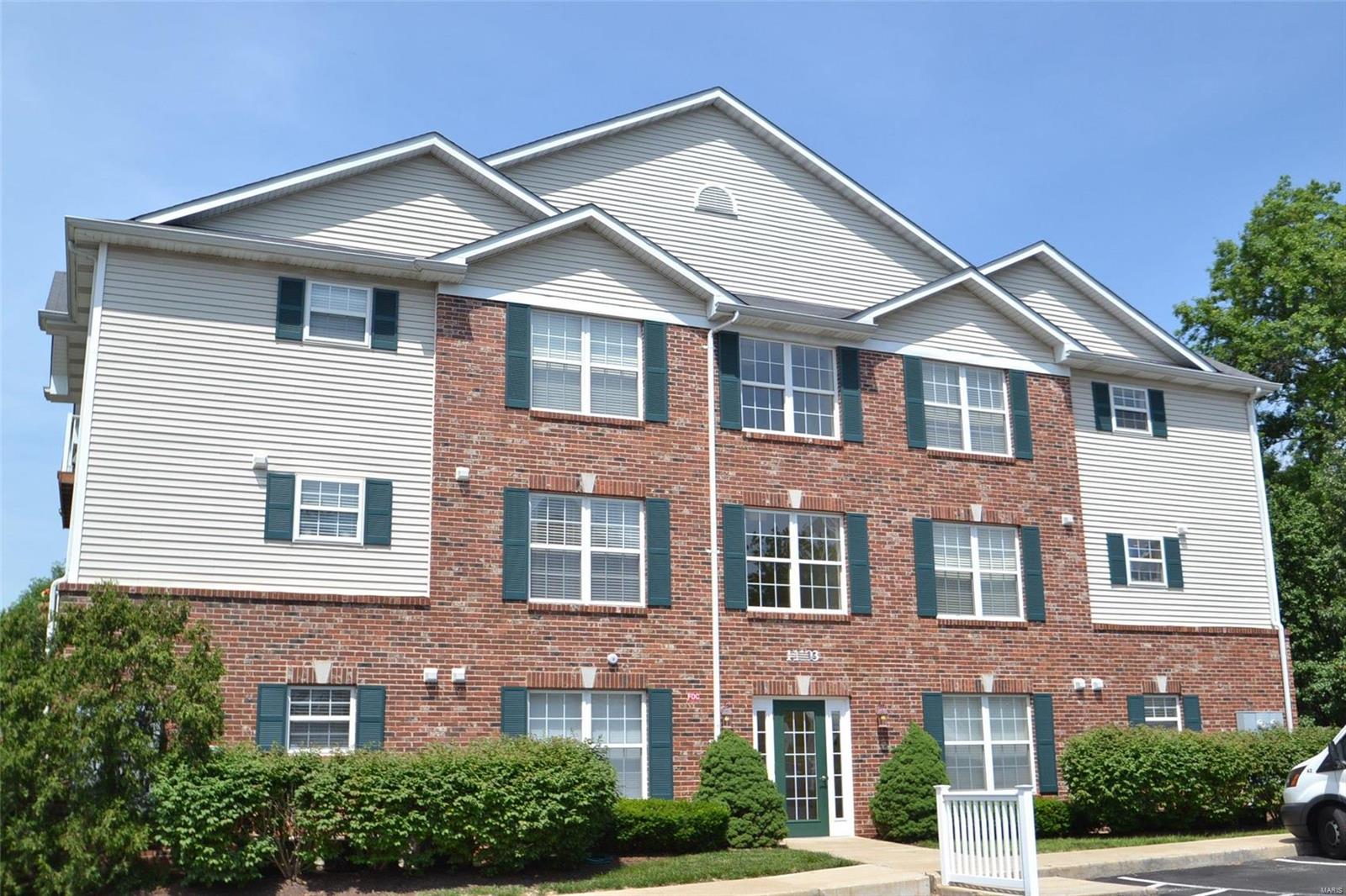 ELEVATOR BUILDING! Wheelchair/Handicap accessible. Very light, bright and beautifully updated throughout!  The entry leads to the large living room area and is open to the updated kitchen with quartz counters, oak cabinetry, stainless appliances, pantry, and room for your dining table, along with space for a planning desk.  Both bedrooms have attached full bathrooms with newer flooring, updated faucets and lighting and the master bath has a walk-in shower while the guest bathroom has a tub. Main floor laundry is a big room so you can have full-size washer-dryer. Porcelain flooring in kitchen, laundry and baths.Enjoy the covered balcony which can be accessed by master bedroom or through the kitchen. Wide doorways, lever handles, walk-in shower in the master bath. New roof just installed on this building. Up to 2 pets allowed, no more than 40 pounds each. Super nice unit! Grant's Trail and Grant's Farm are right next door! Several churches and grocery shopping just a few minutes away. Location: Corner Location