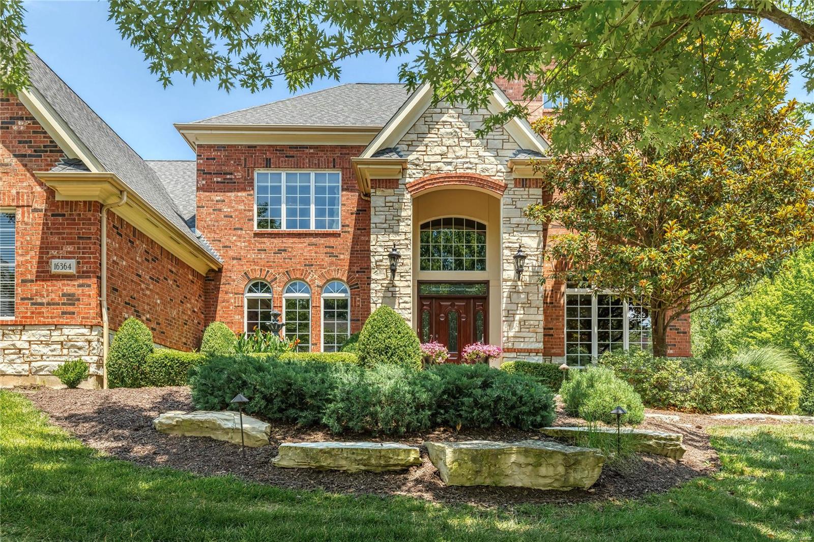 Outstanding Levinson-built 2 Sty in premier neighborhood! Impressive entry foyer highlighted by dramatic flared staircase leads to private study with wide bay window, formal dining room with extensive millwork & spacious great room with brick fireplace, pass-through bar & wall of windows with private lake views. Chef’s kitchen featuring custom 42” cherry cabinetry, granite countertops, Jenn-Air appliances, center island & butler’s pantry adjoins light-filled breakfast room with convenient planning center & vaulted hearth room with brick fireplace. Coffered master bedroom suite provides an appealing retreat with walk-in closet, sitting room & luxury bath.  3 Generous-sized additional bedrooms, 1 with ensuite bath & 2 with Jack n’ Jill bath, complete the 2nd floor living quarters. Broad atrium staircase accesses walk-out Lower Level with recreation room, wet bar, family room with fireplace, office, 5th bedroom & full bath. Situated on a .78-acre lot with deck, patio, pool & 3-car garage.