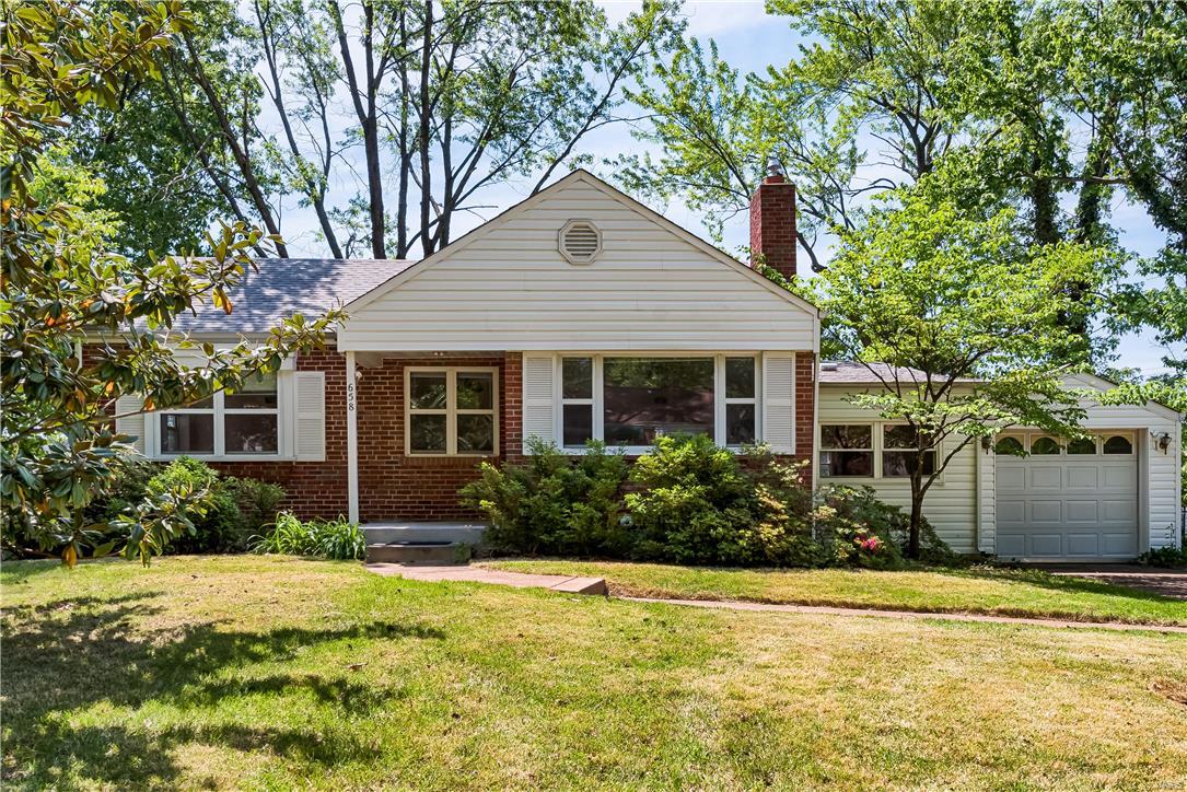 Welcome to this quintessential Webster Groves charmer located in the desirable Yorkshire neighborhood. Offering 2 bedrooms, 1 full bathroom this home is perfect for that buyer looking for some sweat equity to make it their own. Wood floors throughout the main level, and large breezeway with carpet leading to the attached one car garage. Kitchen has granite countertops, tile backsplash, and a convenient pantry. Back deck off kitchen perfect for entertaining or relaxing on a summer evening. Partially finished lower level waiting for the right finishing touches. So much to love here, all in a fabulous school district close to shopping, dining, and so much more!