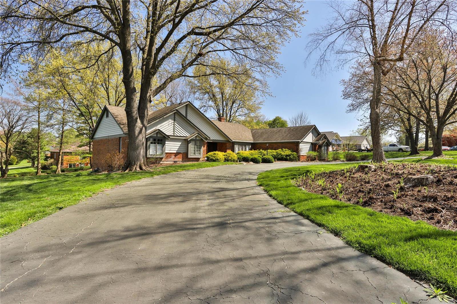 Fabulous ranch sitting on over an acre lot in sought after Barrington Place.  Gorgeous entry foyer with stately staircase is open to large great room with stone fireplace, beamed vaulted ceiling & huge windows overlooking the lush backyard. Spacious dining room with bay overlooking front yard.  Fabulous kitchen with custom cabinets, center island, quartz countertops, viking cooktop, double ovens and a large breakfast area. A cozy den connects the great room and kitchen. There are two main level ensuite bedrooms, both with walk in closets. The walk-in shower in the primary ensuite is spectacular. The laundry room is conveniently located just off spacious mud room.  Downstairs is a huge family room, a rec room, 3 generous size bedrooms, walk in closets galore and loads of storage space.  This turnkey home features gorgeous wood floors, spectacular woodwork and mouldings, a 3 car side entry garage located on a culdesac in Town & Country, close to shopping, restaurants, highways, etc.