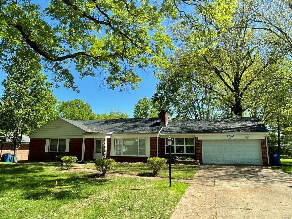Spacious brick ranch with tons of upgrades......new roof, new flooring, and new windows. Stainless steel dishwasher/microwave/range/refrigerator, kitchen sink, counter tops, cabinets, bathroom vanity and more are all new! Lovely wall to wall masonry wood-burning fireplace with built in bookshelves in a large living room.  Ceiling fans.  Two car garage. The property sits on half an acre with a large flat back yard and is on a quiet cul-de-sac street.