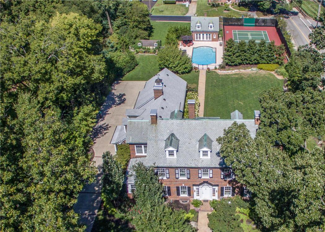 Spectacular Kirkwood estate offers fabulous renovations while maintaining historic beauty & grand architectural features.  Sitting on private 1.3 acre landscaped yard, it’s an oasis within walking distance of downtown Kirkwood.  The saltwater pool, brick carriage house, tennis court & private stone patio offer luxury to enjoy idyllic surroundings.  Inside generous rooms offer space & light w/ special features -Marvin wood windows & atrium doors, 9ft +ceilings, sunroom w/original glass, wood paneled office.  The heart of the home is renovated kitchen & family room  w/ box bay ceiling & double French doors to screened porch w/fireplace overlooking stunning grounds, perfect for entertaining.  2nd floor features fabulous master suite w/sitting room, his & her closets plus balcony.  Two more bedrooms plus sunroom on this level and 2 more bedrooms plus rec room on 3rd floor.  Four car garage, irrigation & security systems, pool house w/ tuck under garage plus outdoor shower & potting shed! Additional Rooms: Sun Room
