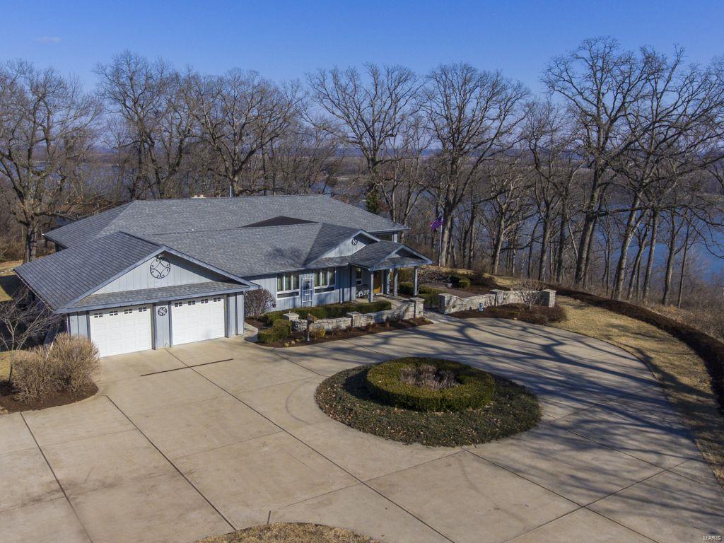 Want the BEST view of the Mississippi River on almost 4 acres in South County? You will love this unique Ranch in it's Private setting. 10 Antique Art Glass Windows were installed in Foyer & in front of the Home. Architect designed home so all rooms on the first floor have a river view along with LL Bedroom & Workshop. The River Room is 36 x 37 and is large enough for any party! 3 Bedrooms on the First Floor & 1 in the LL & 3.5 Baths. Owner currently using the Master Bedroom Suite as an office. So many upgrades in the home & potential for 2 additional bedrooms in LL. Custom Wood Ceilings. Zoned HVAC. Pella Windows with E coating. 3/4 Red Oak Hardwood or Ceramic Tile throughout Main Level. Custom Kitchen boasts Sub Zero Refrigerator, large walk in pantry, double ovens & Bosch Dishwasher. 400 Amp Service. Architectural Roof. In House Vac. 6 Panel Stained Doors. Custom Landscaping. Stone Wall & Patio. Circular Driveway. 4 Car Garage-2 Car Attached & 2 Car Detached. 1 year Home Warranty.