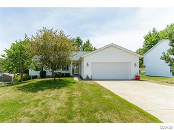 This 1497 sq ft split bedroom home has been meticulously taken care of and has only had one owner. The master provides a walk-in closet and en suite bathroom equipped with a jetted tub. This metal framed home is vaulted throughout the entire length and the unfinished walkout basement has an added 3rd bathroom. You can enjoy the privacy of trees while you entertain family and friends on the back deck. The laundry room adjoins the garage to the home and is versatile as it could be used as a mudroom. The 2 car over-sized garage has room for a workbench and the convenience of highway access is only 5 minutes away. The original wall color and unfinished basement are awaiting your finishing touches.
