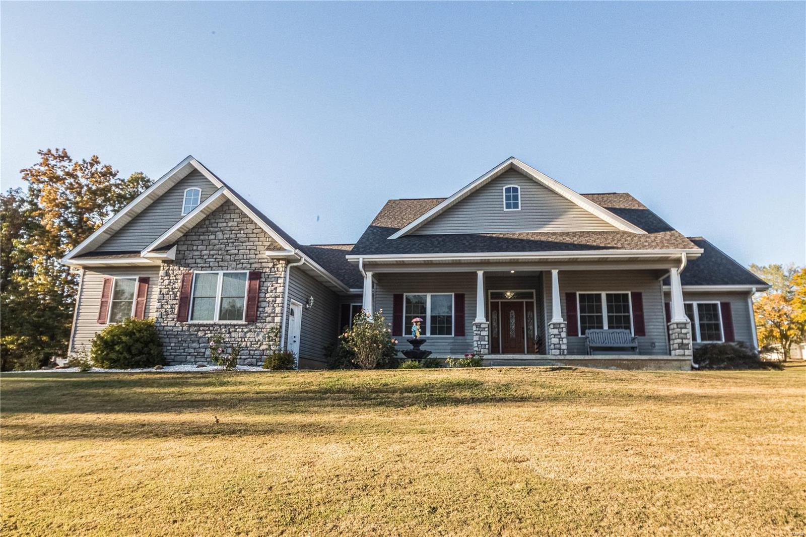 The curb appeal of this home is immaculate, this 3 bedroom (could be 5) 3 bathroom home sitting on a double lot totaling 1.02 acres and is located just outside of town. Upon entering this Craftsman style home the details are instantly noticeable and right off the foyer there is an office on one side and a formal dinning room on the other.  Features this home offers include 9ft ceilings, an extra large kitchen, a walk-in pantry, two large bedrooms with attached full bathrooms.  The Master bedroom offers trayed ceilings and a large walk-in closet as well.  The Master bathroom features a jetted tub and a large walk-in tile shower with double shower heads.  This home also offers an oversized 2 car garage as well.