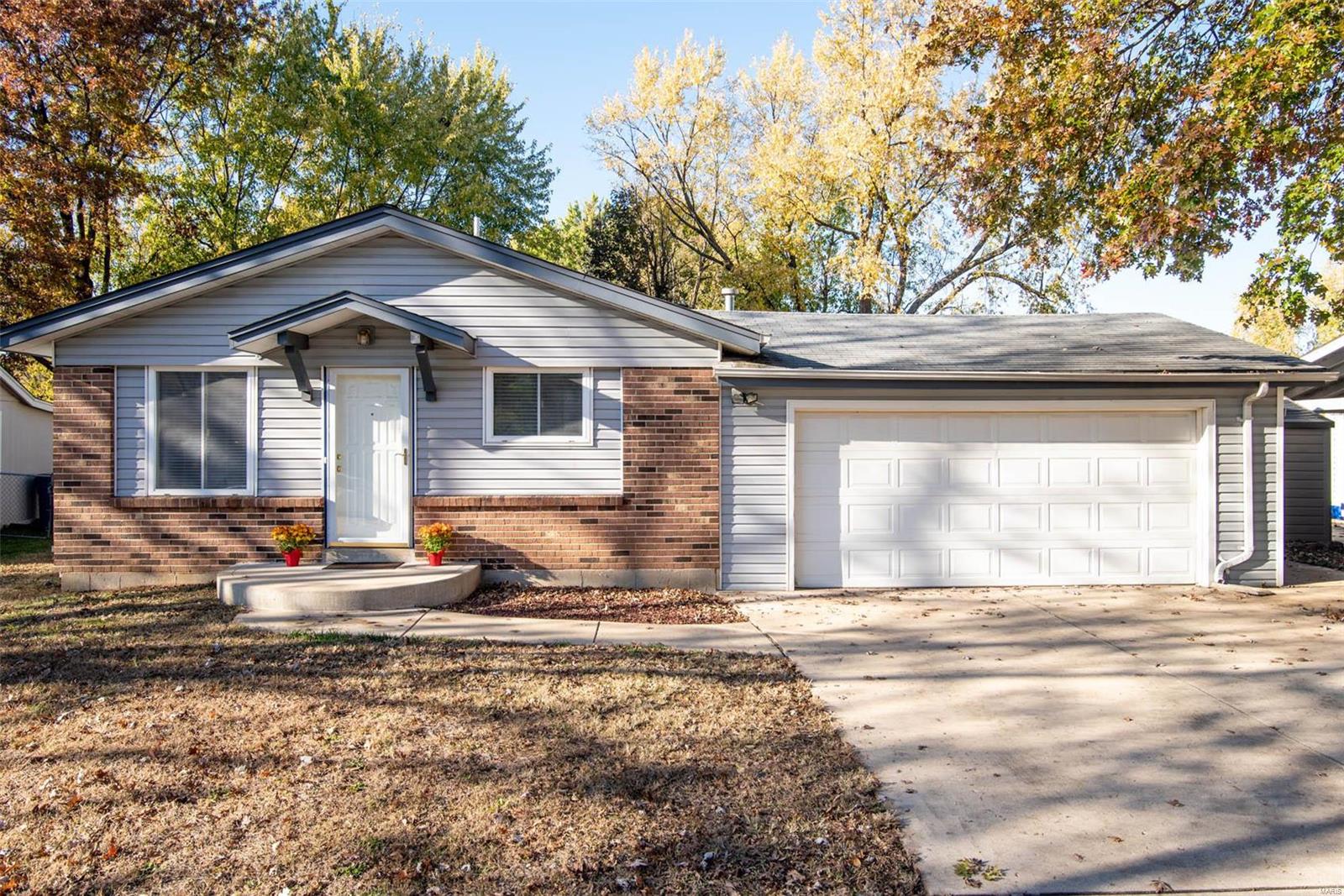 Sellers offering $1000 credit to buyer for countertops/flooring in bedrooms with a strong offer! Adorable 3 bed 2 bath ranch with a total finished square footage of 1650!!!  As you step in you will be greeted with Beautiful wood laminate  flooring throughout parts of home! Entire home has been freshly painted(including trim and doors upstairs) New painted ceiling on most of the main level. New lighting and additional lighting added to home! Enjoy cooking in this light and bright kitchen that offers new stainless steel appliances (built in microwave, smooth top range, and dishwasher), breakfast bar, and tile flooring. Bedrooms offer closets with custom built in storage! The fully finished lower level offers a family room, rec room, office (currently being used as a bedroom) and full bathroom. Oversized garage! Newer roof over main living area! Newer water heater! Enjoy barbecues on spacious patio with family!  Large spacious yard is fully fenced!  Easy access to 364, 70, and 94!