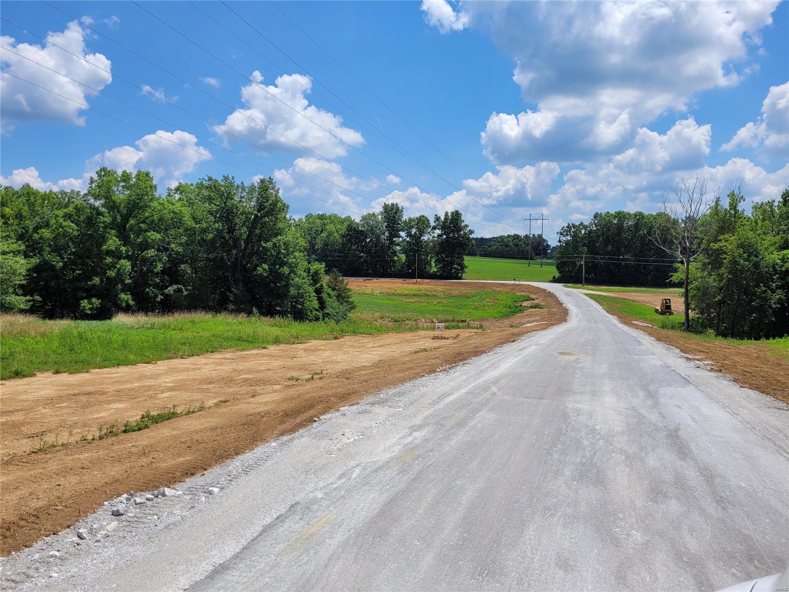 A scenic private drive leads you to this beautiful, park-like 3.1+- acre lot, perfect for custom home building.  These picturesque lots are a mix of gently rolling pasture and woods.  Newly paved blacktop roads.   Lots 1, 5 and 6 feature a wet-weather creek and Lots 4 and 5 share a small pond.   Conveniently located just 10 minutes to Hwy 70 and 20 minutes to Wentzville, so you can enjoy the country life with city amenities nearby. Minimal deed restrictions:  2000 sq ft minimum home, plans to be approved by developer; no mobile homes; no junk yards; no unlicensed vehicles; no hog confinements. Additional Rooms: In Platted Subdv.