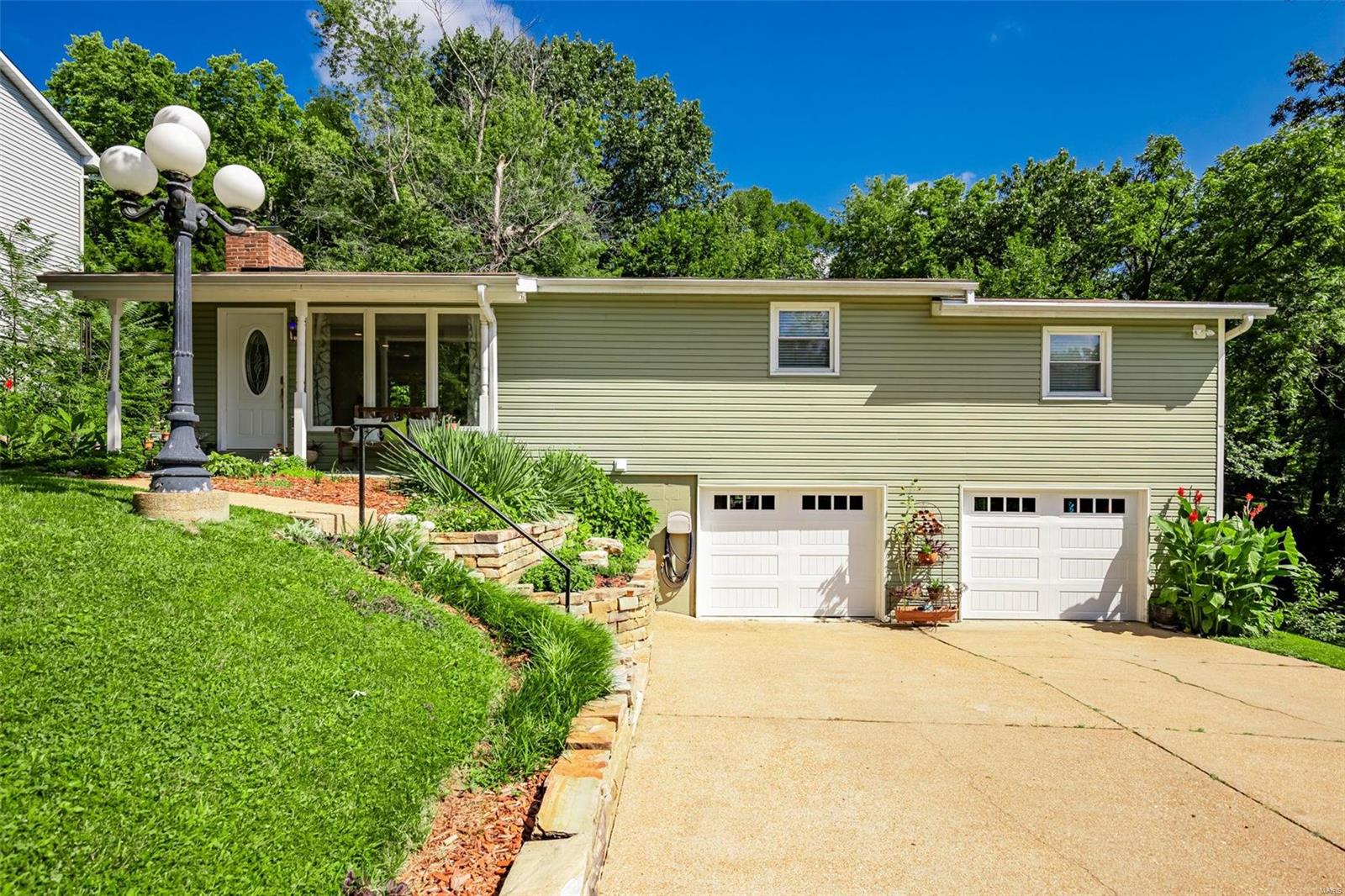 Price Adjusted! 
This charming home on a dead-end street with a private backyard is a delightful find. From beautiful wood flooring to the modern updates, the house exudes comfort &  style. The newer HVAC, windows, flooring, siding, garage doors & updated electric. Beautiful landscaping enhance both its appearance & functionality. The Galley Style Kitchen has plenty of room to expand into the Dining room area. Kitchen has been updated with Granite Counter Tops, Tile backsplash & is open to Dining & Great Rooms, creating a welcoming space to connect with loved ones. New carpet in Bedrooms & hallway.  Finished basement, & additional small kitchen, Laundry & large closet, an oversized garage and family room, provides versatile options for personal use. Abundant closet space ensures neatness and organization. Enjoy the convenience of nearby shopping and restaurants. This home promises a delightful living experience, combining modern comfort with a touch of tranquility.