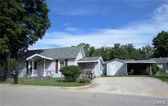 Charming 2-bedroom home with lots of updates!  Home is basically a 1-owner and very well maintained!  It features newer vinyl siding, double pane windows, nice Oak kitchen cabinets, a covered porch and a large fenced-in lot with a small workshop, carport and utility shed!  REDUCED!