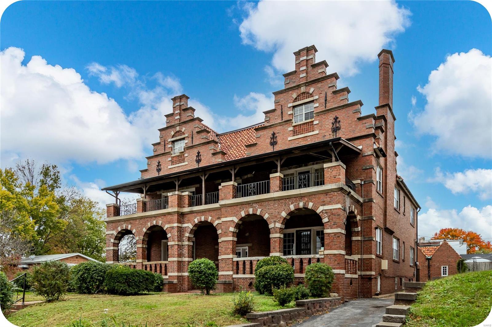 Built in 1928 and owned by the same family since 1962, this beautiful architectural gem is ready and waiting to be returned to its original condition.  Sitting impressively on a large corner lot in the heart of the Carondelet neighborhood just across from Lyon at Blow Elementary and the Historic Carondelet YMCA.  The stunning Spanish style front facade with arched brickwork, ironwork, leaded glass and 4 large private front porches takes your breath away.  At just under 9,000 sft, the building is comprised of 6 individual rental units on 3 floors.  Around back you'll find an equally beautiful brick carriage house/garage with 2 covered parking spaces and 2 sizable storage spaces.  The entire building is in need of a renovation but some original wood floors, tile work, and fireplaces are in good condition.  This is a unique project that is guaranteed to bring you joy and pride of ownership!