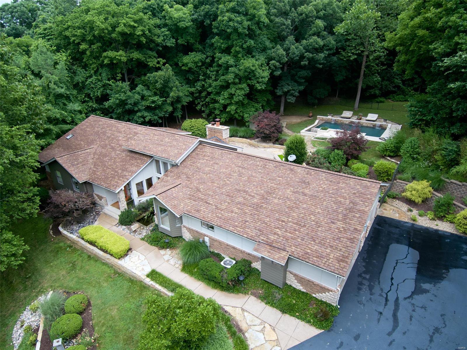 Uniquely Exquisite! One of a kind home and opportunity on 3.63 acres.  There are 5 bedrooms & 5 1/2 baths. 3car oversized garage, salt water vanishing edge pool, main floor laundry, sprinkler system with container watering system, invisible fencing for your pets. Roof replaced in 2015, furnace & A/C-2016. James Hardie siding all around, 1300sf of PVC Decking. Hot tub, Hideaway room, Private entrance to a LL in Laws suite. Replaced driveway, kitchen, bathrooms, lighting, new space closets, wine cellar open stairway to the LL family room.  Security cameras  and monitor.  All appliances stay , pool table included.  There is a central vac system, landscaping lights, built in speakers inside and on the deck & pool area. Don't miss seeing this spectacular home. A complete Package you could move right in! Additional Rooms: Wine Cellar
