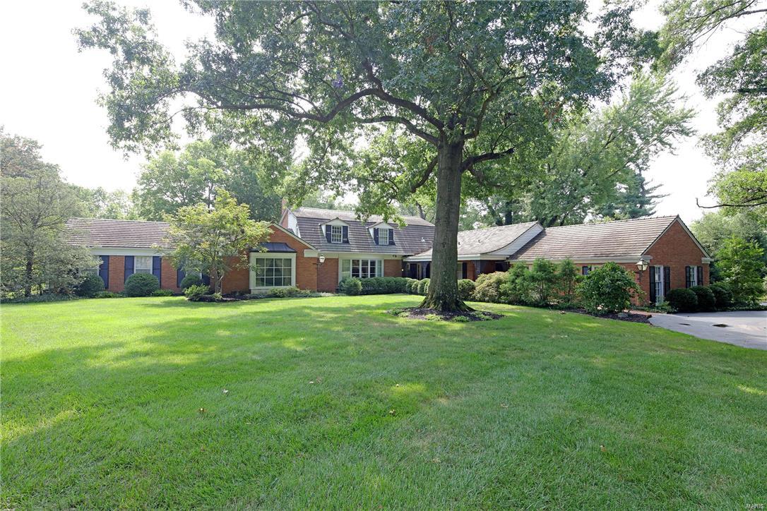 On 2.8 beautiful acres with lots of trees and privacy. This gracious home opens to a pretty gallery entrance that leads to the large light filled front hall and formal living and dining rooms where there are numerous floor to ceiling bay windows. Special Millwork.A bright and spacious gourmet kitchen has granite countertops--plenty of space here. The first floor master bedroom suite has a dressing room & a long hallway of closets! An adjacent additional bedroom could also be used as office. A third first floor bedroom with its own full bath is at the opposite end of the first floor. There is a lovely paneled family room near to the master bedroom which has a wet bar and a second fireplace and walks out to a spacious Florida room that overlooks the handsome yard--lots of room for pool and/or tennis court. Upstairs are two additional bedrooms(one presently used as an office)and a large full bath. Lovely views from all the windows of the house.