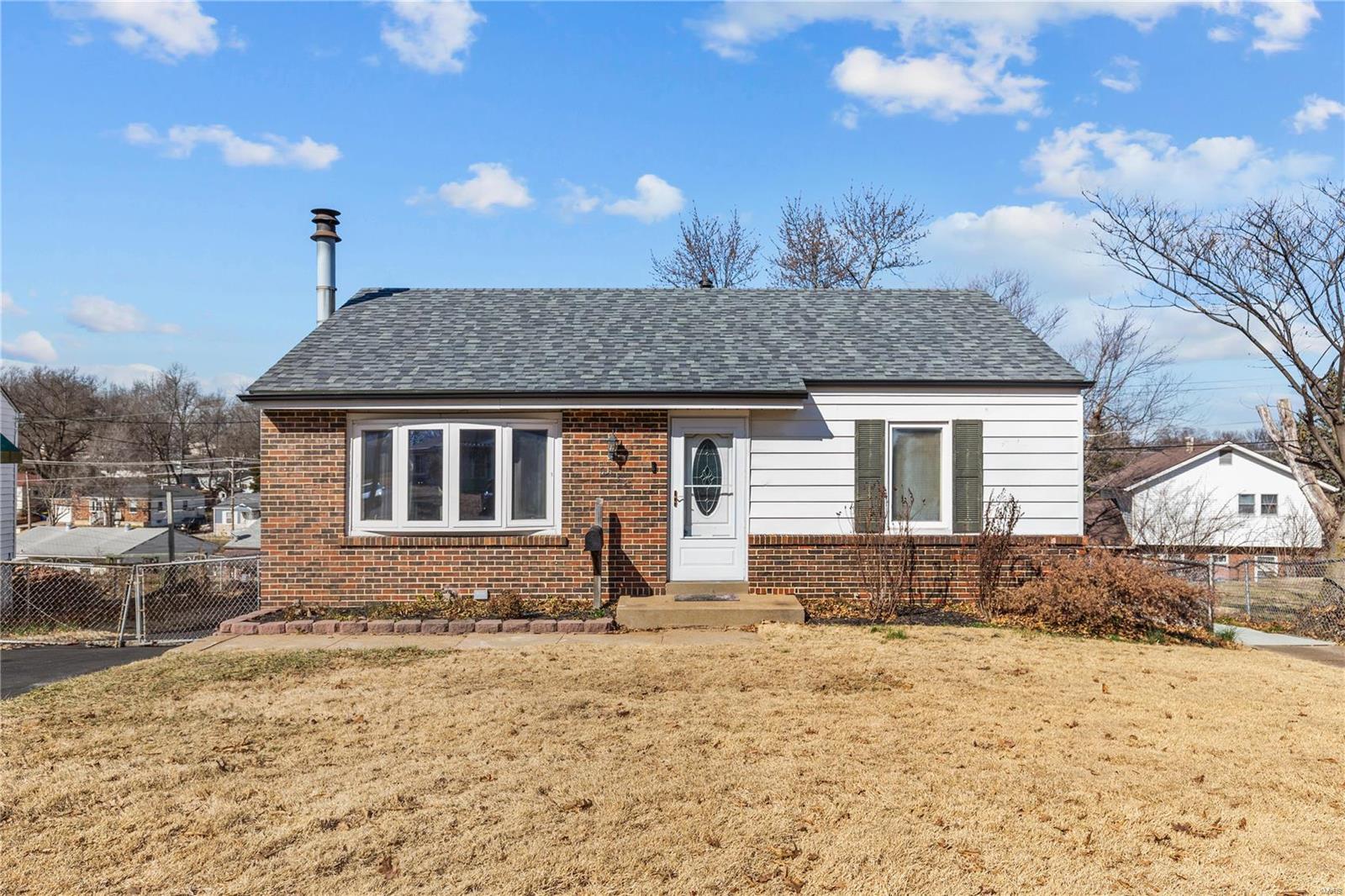 Great for Rental Portfolio! Quaint little brick front ranch just waiting for your personal style.  It is a 2 bdrm, and 1 full bath (recently updated) in a quiet neighborhood.  Living room is open to dining room area, galley kitchen with portable dishwasher. Built in corner bookshelves in living room,  ROOF NEW 2021 Newer Furnace/HVAC in 2017 (serviced bi annuallly), Water heater replaced also and newer tilt in windows. Fenced in back yard with dual layer deck to enjoy.  Off street parking.  In the basement there is washer/dryer and partiioned rooms for your storage and additional living space.  It is in Ritenour school district, within minutes to Buder Elemantary.  Home has low maintenance vinyl siding. Original hardwood floors are ready for buffing. Big ticket items are done for you!! Come see this adorable home before it is gone!