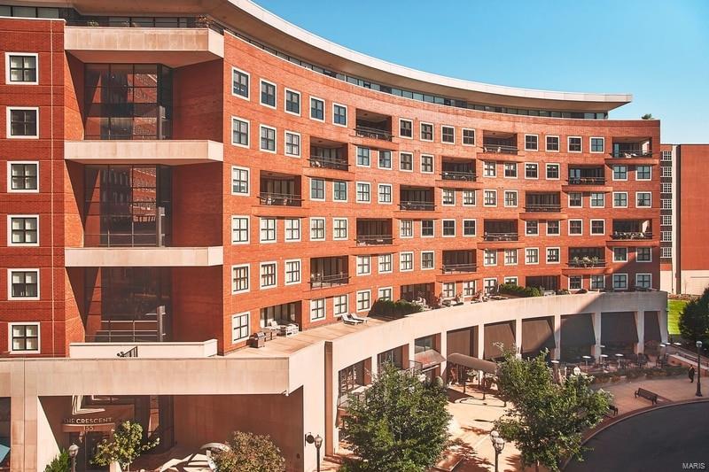 Stunning move in ready condo at The Crescent with 2 beds + 2.5 baths with 2400 sf overlooking the fountains on Carondelet Plaza. This sunlit south-facing unit is located on the architectural curve with large terrace accessible from 3 rooms. Walk into the large open floor plan with neutral finishes featuring hardwood flooring that encompasses the living room, dining room, kitchen & breakfast room. Chef's kitchen with granite countertops, Wolf & Sub-Zero appliances, custom cabinetry, breakfast bar, butler's & storage pantry. The expansive Master suite with stunning views has 2 walk-in closets, walk in shower, double vanity, tub & heated floors. A second en-suite bedroom is perfectly situated on other side of the unit. Additional features- Built-in bookshelves, gas fireplace, 10-FT ceilings, crown moulding, laundry room & private balcony. Building amenities: 24-hr doorman, valet, on-site mgr, concierge, club/media room, fitness center, dog park, secure/heated garage w/2 parking spaces. Location: Interior Unit