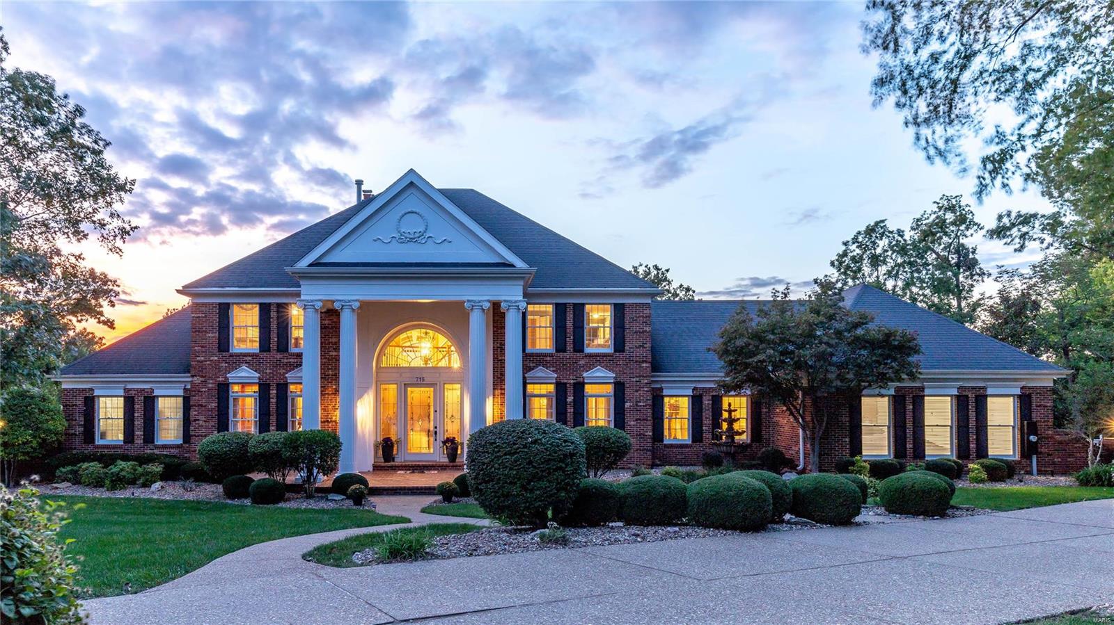 Magnificent brick 1.5 Sty on Whitmoor Country Club grounds!  Grand 2-sty foyer highlighted by dramatic curved staircase leads to library-paneled study, elegant dining room & coffered great room with marble fireplace, bookcases & 2-sty wall of windows overlooking the lake & North course. Chef’s kitchen with custom cherry cabinetry, granite countertops, premium stainless steel appliances & convenient planning center adjoins breakfast room with adjacent wet bar & vaulted hearth room with floor-to-ceiling brick fireplace. Sumptuous master bedroom suite offers an appealing retreat with His & Hers walk-in closets, wide bay window with French doors to deck & beautifully appointed bath. Front & rear staircases access 3 generous-sized additional bedrooms, 1 with ensuite bath & 2 with Jack n’ Jill bath. Lower Lever includes recreation room with fireplace, game room & spectacular gathering bar plus guest suite & full bath. Situated on a private cul-de-sac lot with tiered decks & 3-car garage.