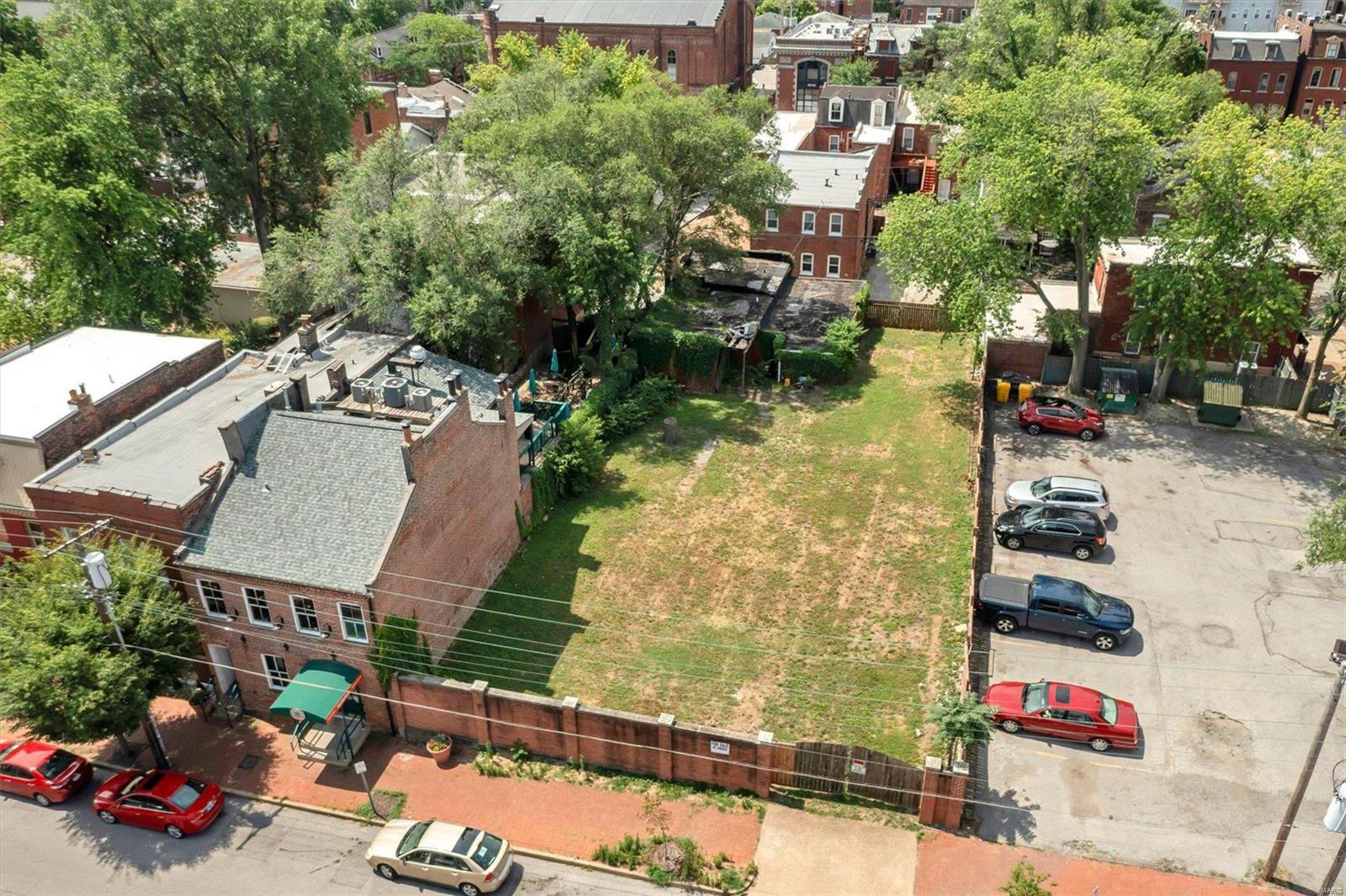 Welcome to the largest undeveloped lot in the heart of Soulard! Note the 65' of road frontage, 140' deep lot, and 8' brick wall across the building line. This land is also completely fenced in. Soil testing, and all abatement on the existing structure has been completed, and a full set of drawings including architectural and civil have been completed for three and two row houses. The signed and sealed set of drawings (see supplements) will be granted to the future owner for development and permit. This lot is zoned G commercial, with the potential to build residential, retail, or even both with commercial on the first floor and apartments above. The possibilities are endless, and the location is unbeatable! Location: Downtown