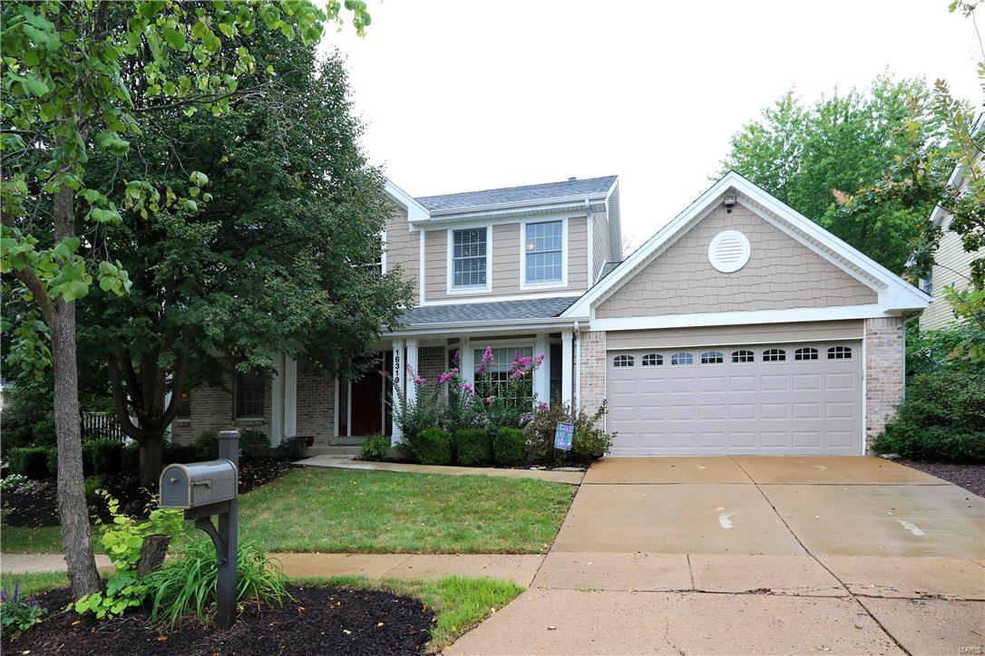 Charming 1.5 story is bursting with beautiful updates throughout! Hardwood flooring adds warmth and character on the main level.  Staircase makes a statement & accents 2-story foyer leading to elegant dining room with crown molding, bay & access to the beautiful kitchen equipped with center island, soft-white cabinetry, granite countertops, walk-in pantry, planning desk & breakfast room. Great room boasts brick fireplace, soaring ceilings, Palladian windows &  wet bar perfect for entertaining. Main floor master retreat is complete with walk-in closet, ceiling fan & updated luxury bath with exquisite tile work, double sink vanity & separate tub & shower. Upstairs are three more spacious bedrooms with neutral carpeting, two share connecting bath. Freshly landscaped with deck, patio & additional paver patio. Main floor laundry. Lower level waiting for you to finish as you choose! Subdivision amenities - pool & tennis!  Minutes from Rockwood Schools & Wildwood Town Center!