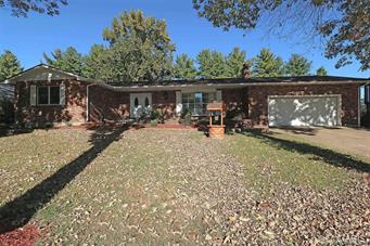 Beautiful 4 bedroom 3 bathroom FULL brick ranch-style home, located in well established neighborhood of Holiday Park Estates. This lovely home boasts over 2900 TOTAL SQFT of living space, nice open floor plan features formal living room with a Wood-burning fireplace & stone accent wall. Great kitchen with LOTS of cabinet space, NEW tiled back-splash, counter tops, cook-top and new refrigerator. All bedrooms offer ample closet/storage space. Nice main floor laundry, and there's plenty of room for a family & friend movie or game nights in the nicely finished lower level family room! There is also a great bar area, & full bath! The partially finished lower level also offers a sleeping area & storage room! Enjoy BBQ'ing your favorite foods out on the back deck! Home is situated on a nice level lot with matures trees offering plenty of shade. Lots of updates including beautiful new vinyl plank flooring, fresh paint all through out the home, updated light fixtures, new electric panel & more!