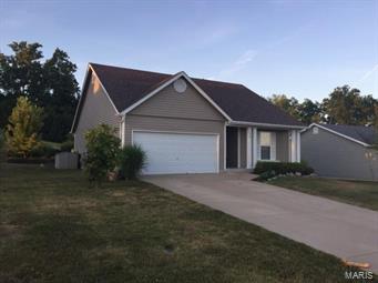Here's the charming spacious & cozy home you've been looking for. Looks can be deceiving, this home boasts over 1900 sq. ft. including its finished lower level. Main floor has an open floor plan with vaulted ceilings in the great room, kitchen & breakfast room-great area for family time & entertaining. Master suite has a walk-in closet & bathroom with a tub & separate shower. There are 2 other bedrooms with large double closets & another full bath. Coat closet located in entry foyer. Beautiful durable wood laminate flooring in living area of main floor. Lower level is partially finished featuring 2 rooms, large family room, the other to be of your choice. Upgrades include new roof in 2015, 50 gallon water heater in 2014 & newer dishwasher in 2016. The yard is very large and backs up to woods, friendly neighbors. Great home to raise a family or enjoy grandchildren in.