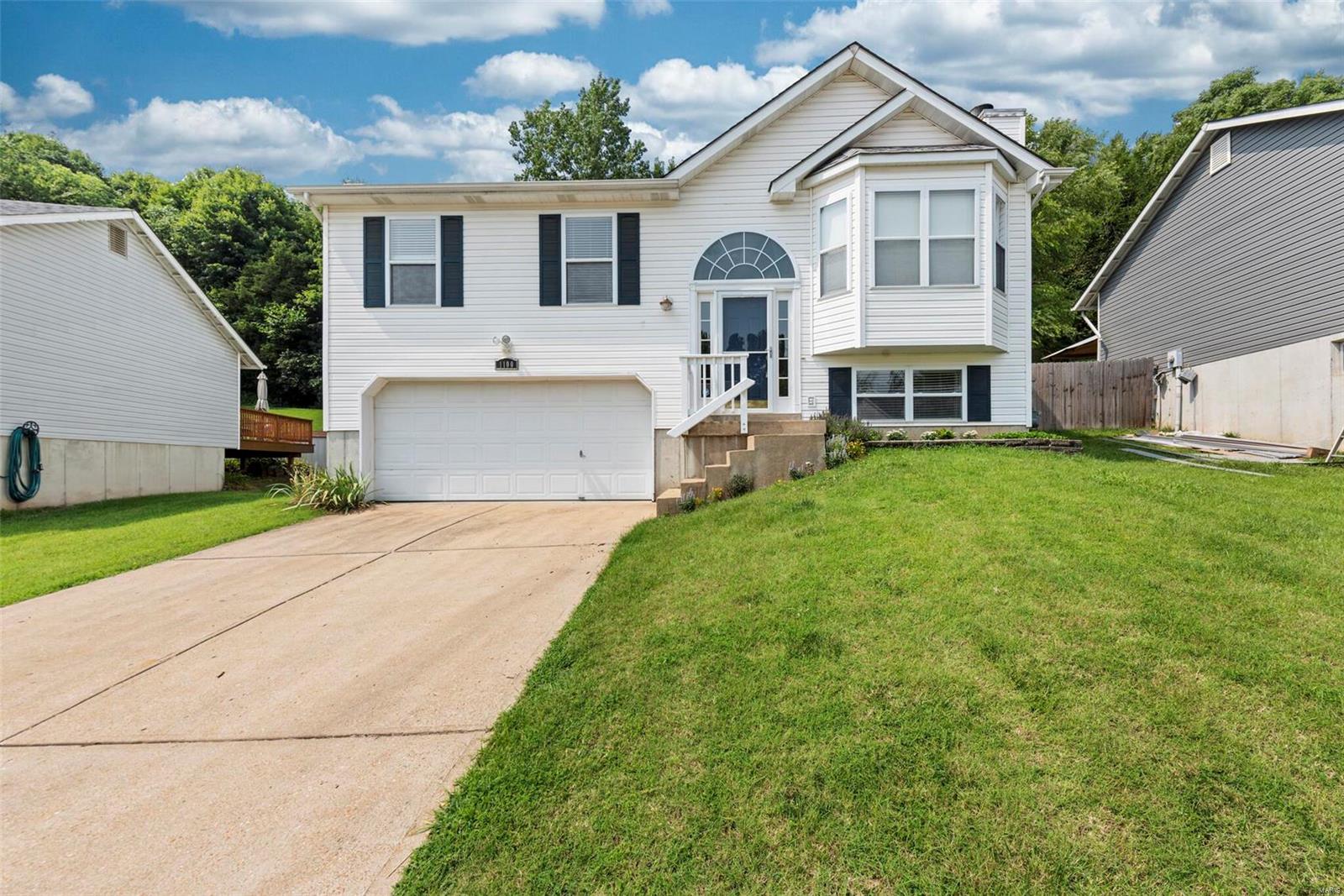 Welcome home to 1100 Fenton Park in the sought after Fenton Park neighborhood.  Whether your just starting out or downsizing, you'll love the open floor plan with vaulted ceilings.  Living room has vaults, bay window and wood burning fireplace.  Kitchen floor has been upgraded to a luxury vinyl plank.  There's a pantry and plenty of cabinets and counter space. Master bedroom suite has an oversized shower, vaulted ceiling and bay window. 2 more bedrooms and a full bath complete the main level.  The lower level has a new laundry room, a family room and full bath with jetted tub.  There's a deck off the kitchen that leads to your fully fenced backyard and patio.  Enjoy your privacy as it backs to woods. Fox schools and close to Gravois Bluffs Shopping, Fenton Dining, Minnehaha Park for hiking along the Meramec Greenway, George Winter Park, and easy access to Hwy 141 & 44 - all adding up to a great location.