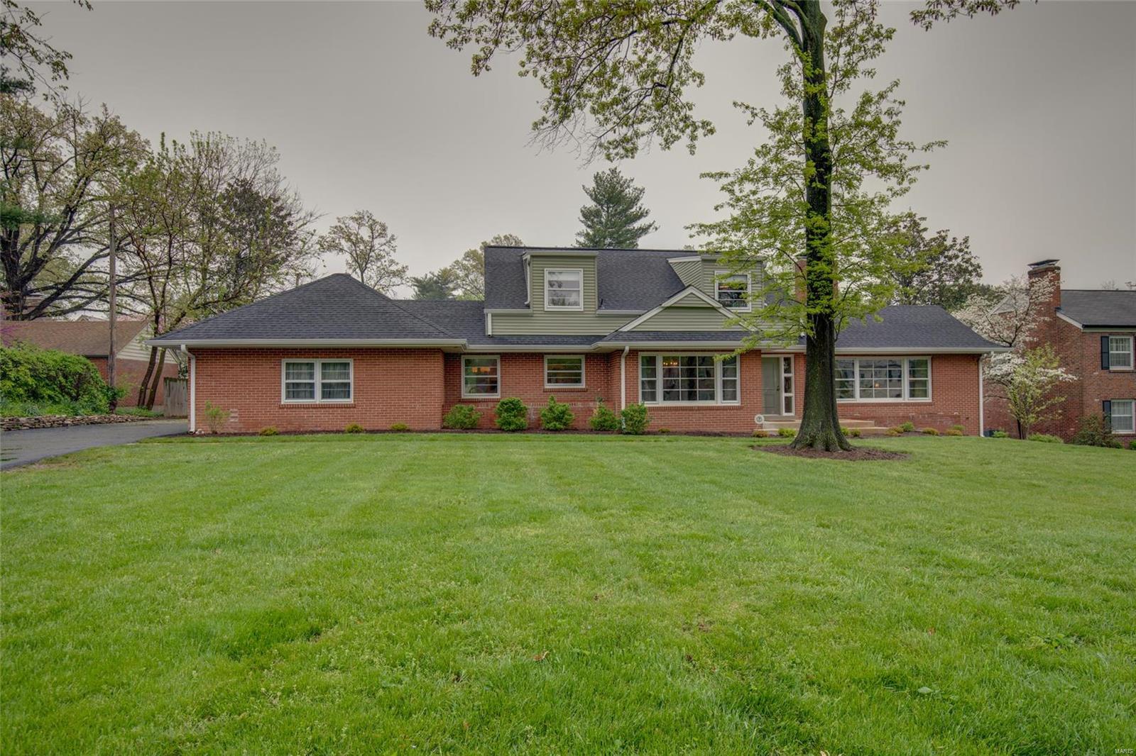 This 1.5 story home offers a luxurious lifestyle within a park-like setting. Top ranked Ladue Schools, sought-after Chevy Chase neighborhood & a spacious & lovingly updated home. An entry opens to the handsome LR & equally impressive DR. The updated kitchen w/marble counters, glass-inlaid cabinets, 2 sinks, and under-mount lighting & stainless appliances will excite the robust cook & baker. A breakfast area is perfect for informal dining & opens to a spectacular backyard - ideal for outdoor leisure & entertaining. The attached 2-car garage makes for comfortable living. A main level master w/walk-in closet & a spa-like updated bathroom w/heated floor, jetted tub and floor-to-ceiling tiled shower is your own private retreat. A 2nd bedroom, den & powder room completes the main. The 2nd floor landing w/built-ins opens to the 3rd & 4th bedrooms, 2nd updated full bath & terrific storage. Accessibility to area parks, shopping & dining and I-64/170, Washington University & Downtown Clayton.