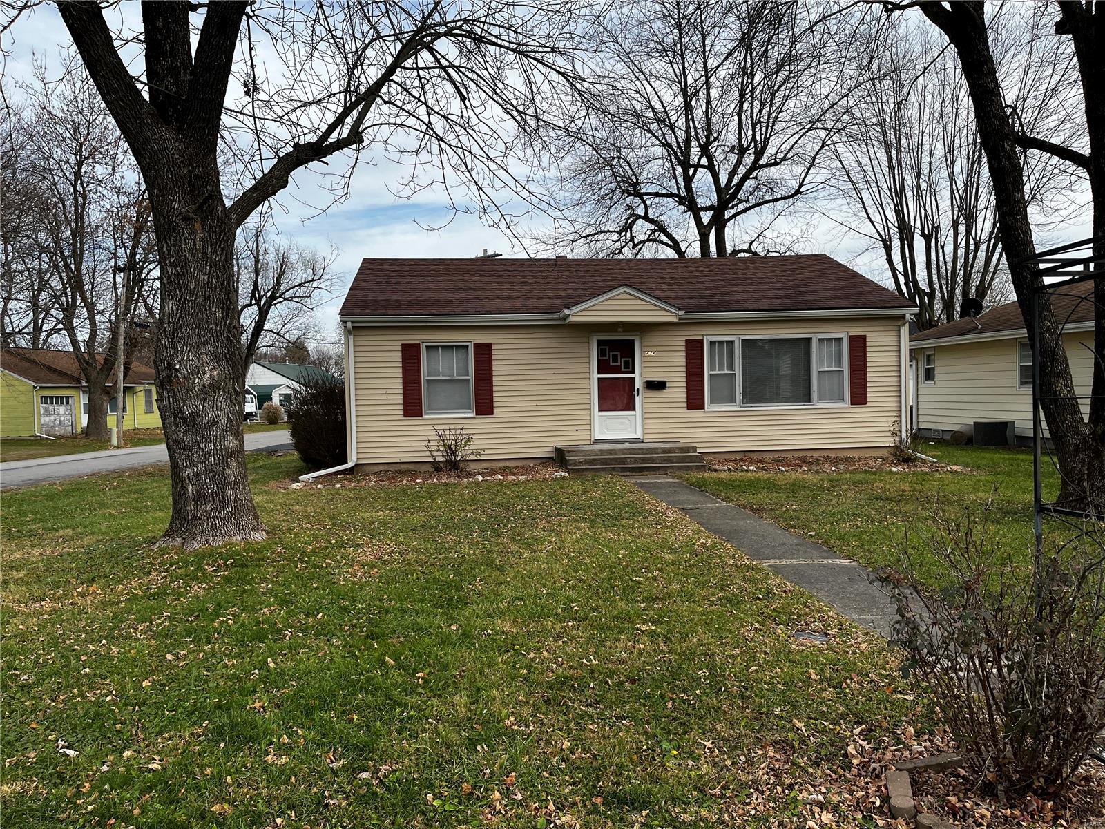This two-bedroom home is super clean and ready to move in. This home has fresh paint, a newly remodeled bathroom, and custom kitchen cabinets. It comes with a newer roof and vinyl siding as well as a new patio roof. Sitting on a corner lot in a great location, you won't want to miss this one.