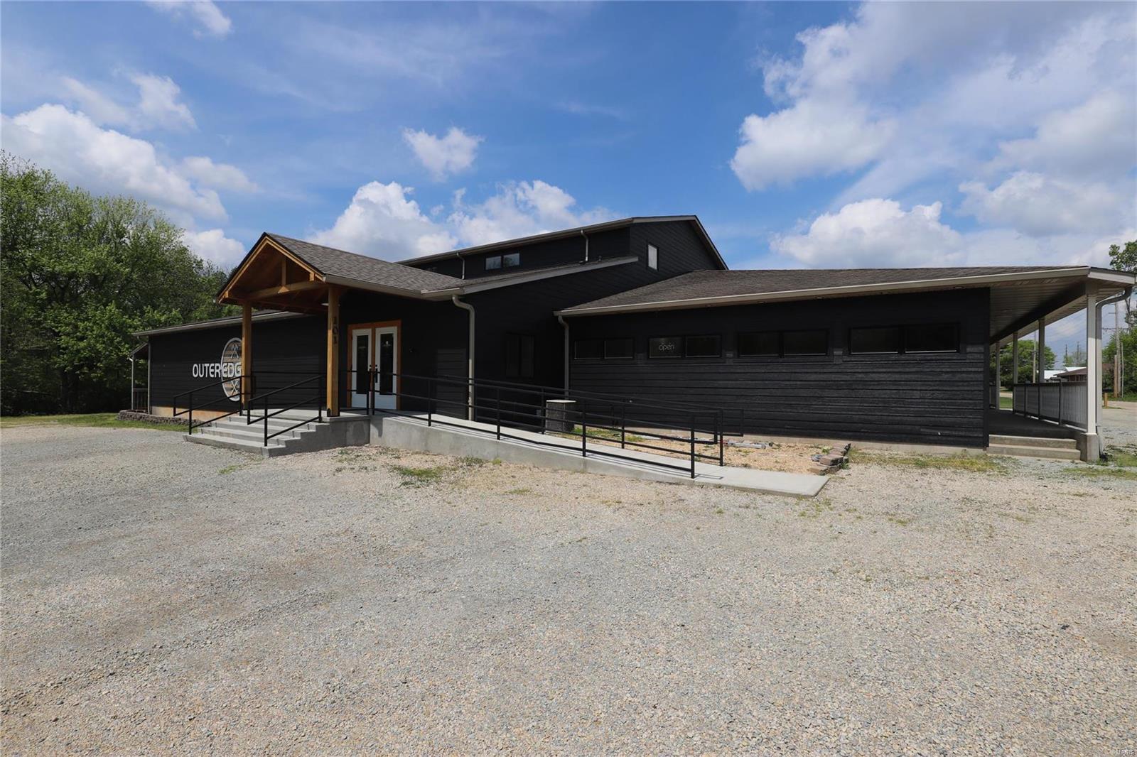 OPPORTUNITY!!!  If you're looking to start your own business or invest in a prime commercial location in Farmington...then this is it! 3.2 acre corner lot with high traffic visibility. 17,000 square foot building, 5 bathrooms, with rough ins for 3 more. Endless layout options in this space. the upper level is completely open to be put to whatever use you desire. full basement, with covered, ramped dock door that is currently used as manufacturing space.  Take a look at the photos, schedule your showing, and start your dreams today! Office spaces on the main level have current leases in place, as well as the barbershop. Location: City, Corner Location, High Traffic