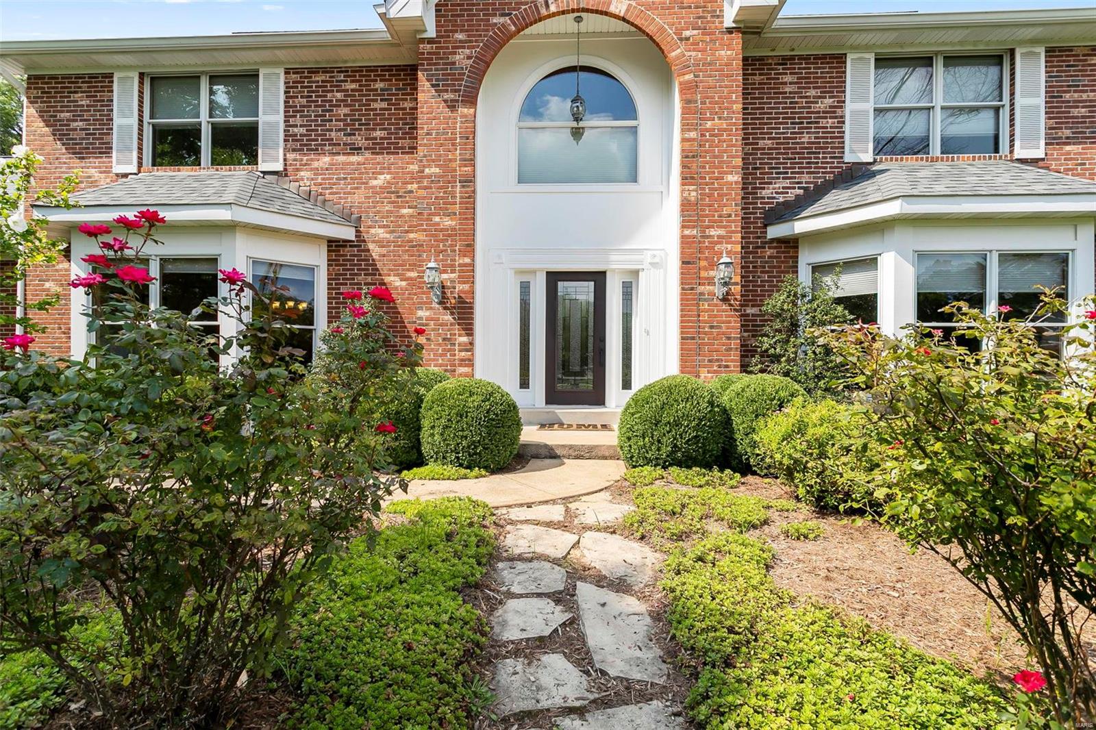This full brick 2-story Town & Country home has everything! A main floor primary bedroom with en-suite and walk in closet, main floor laundry/mud room, NEW Kitchen, large yard with electric dog fence, over sized 3-car garage, finished basement space with theater room, entertainment area with a walk out, full bathroom and office/sleep space with a SECRET room! There is a grand fireplace,  a large main floor office with South facing bay windows and glass french doors, great for privacy while working from home or studying. This well established community is near main highway thoroughfares, hospitals, restaurants, shopping and great neighbors! It is a traditional home with mature trees, a charming front path, a grand entrance and nice back deck for grilling and outdoor dining. This home is the perfect size, main floor living with guest space and entertaining space or a home large enough for many to live, sleep, dine and play. Don't miss this beautiful home with a redesigned kitchen (2021). Some Accessible Features Additional Rooms: Mud Room, Sun Room